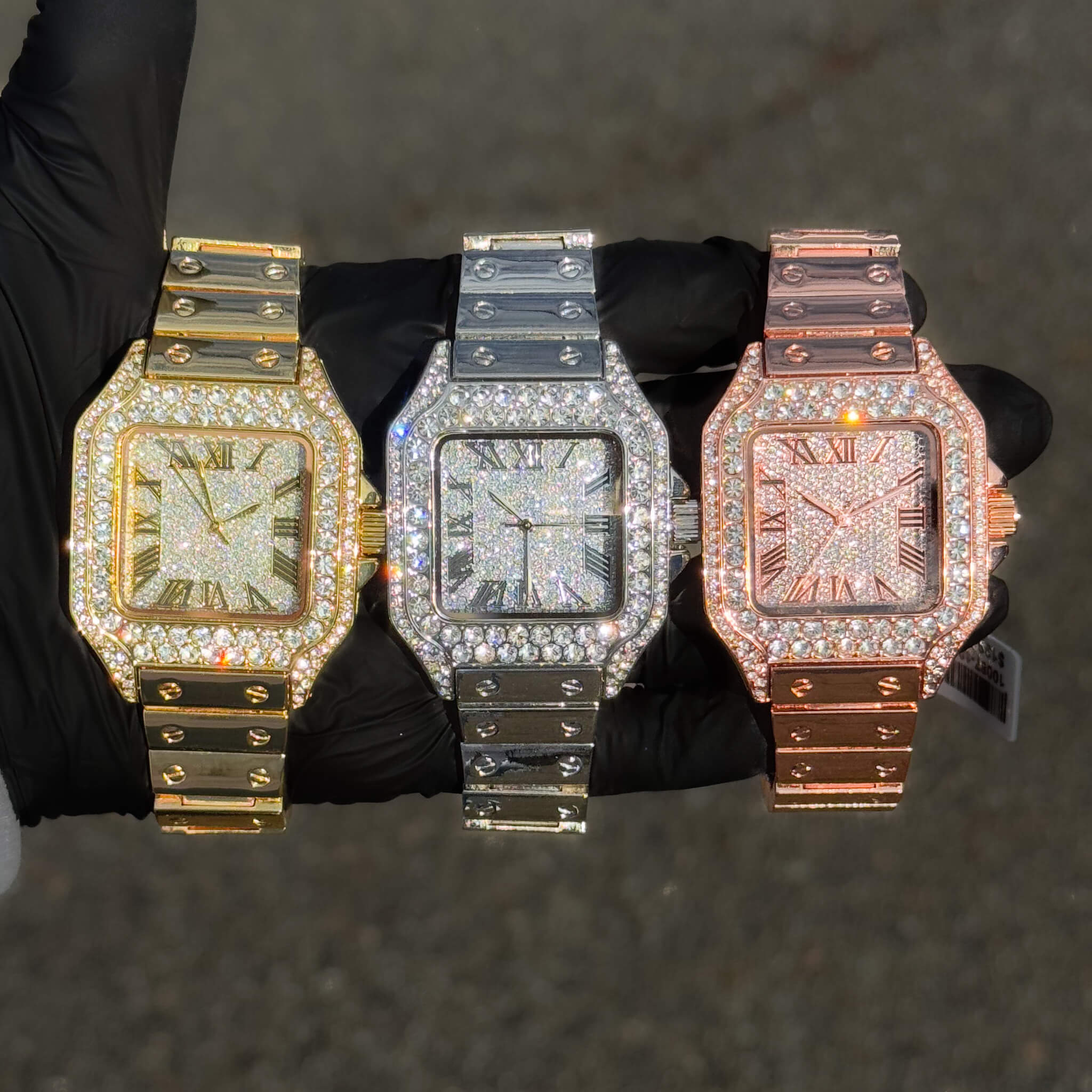Gold, silver and rose gold 40mm iced out square dial men’s watch with metal band.