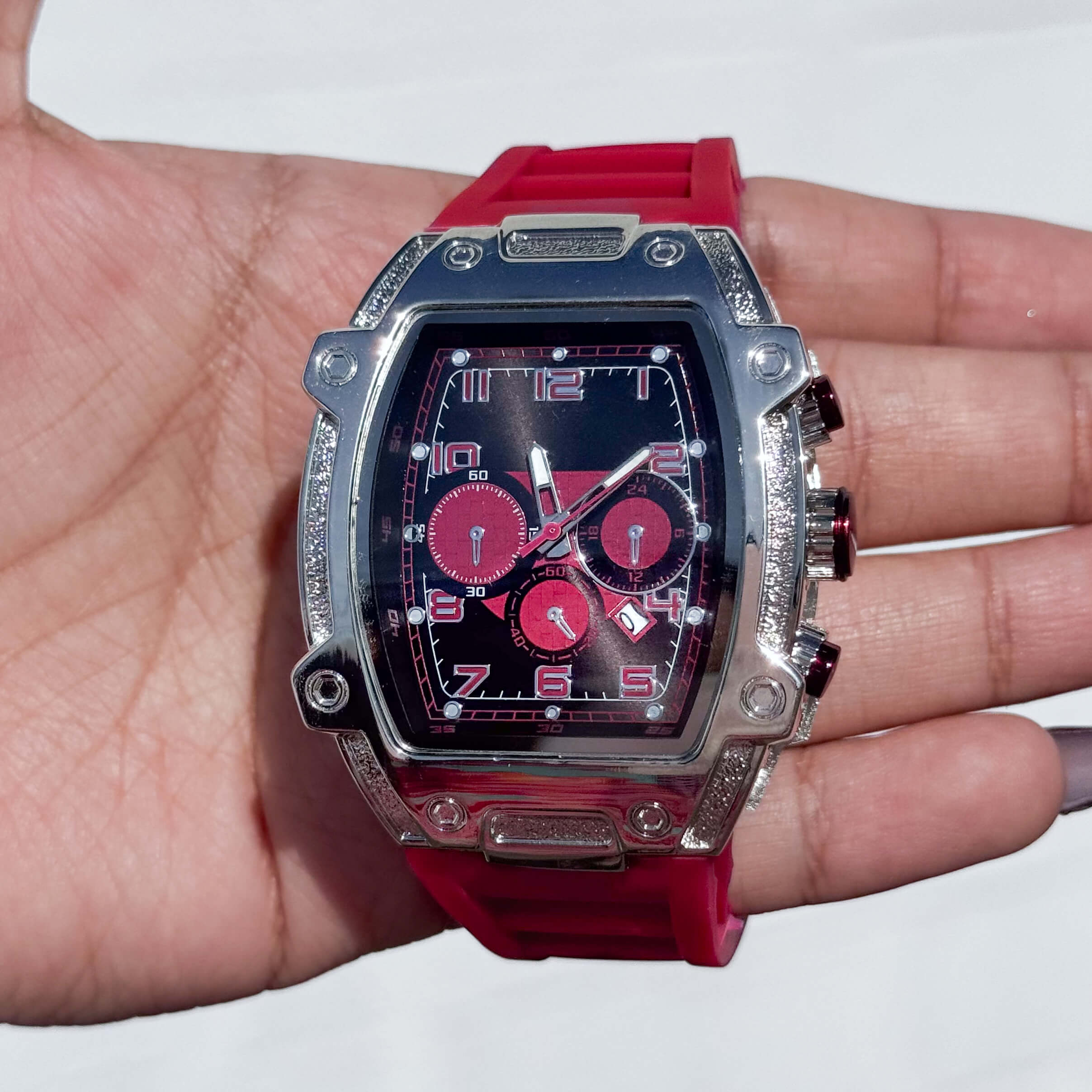 Red Men’s 41mm tonneau silicone band watch with silver case and bold red chronograph quartz dial.