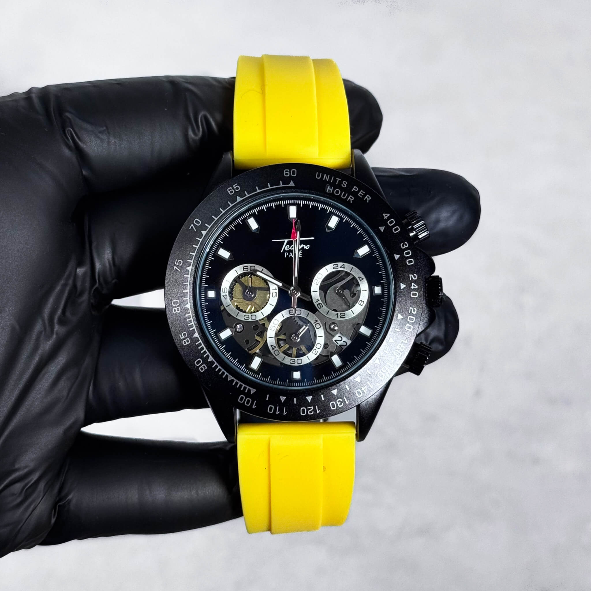Yellow-band Men’s 42mm silicone chronograph-style watch with black dial and multi-dial quartz face.