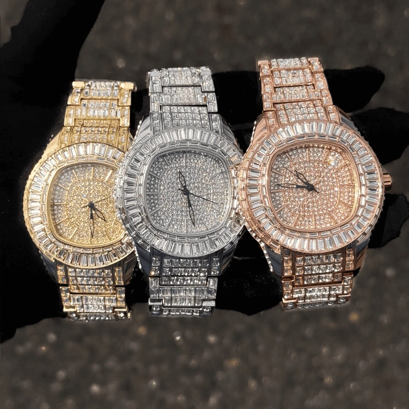 Gold, silver, and rose gold Men’s 48mm Fully Iced Out Baguette Watches with quartz movement.