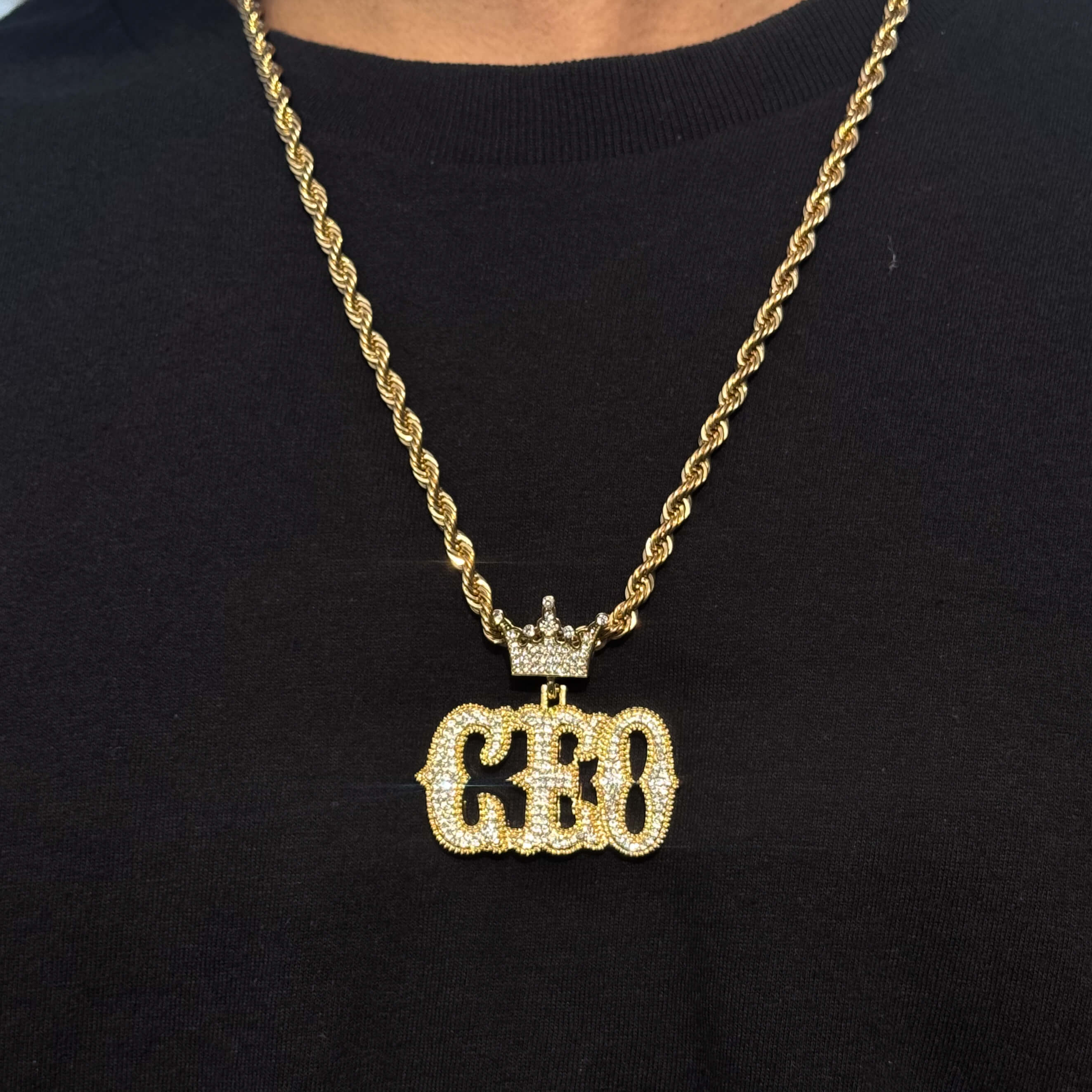 Men's Large Iced Out CEO Pendant with gold 8mm rope chain featuring crown design and crystal details.