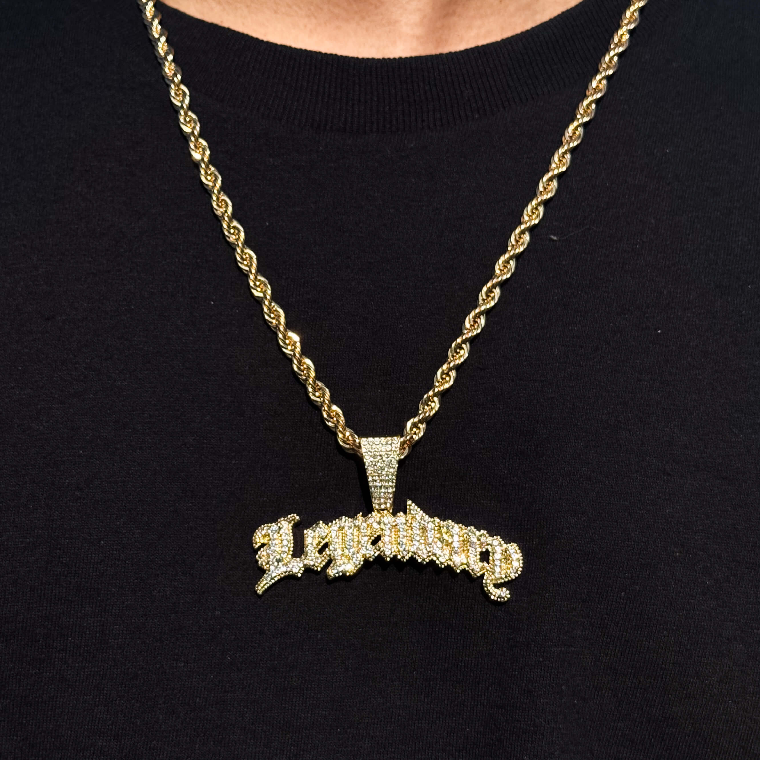 Men's gold iced out Legendary pendant on 5mm rope chain, sparkling rhinestone design.