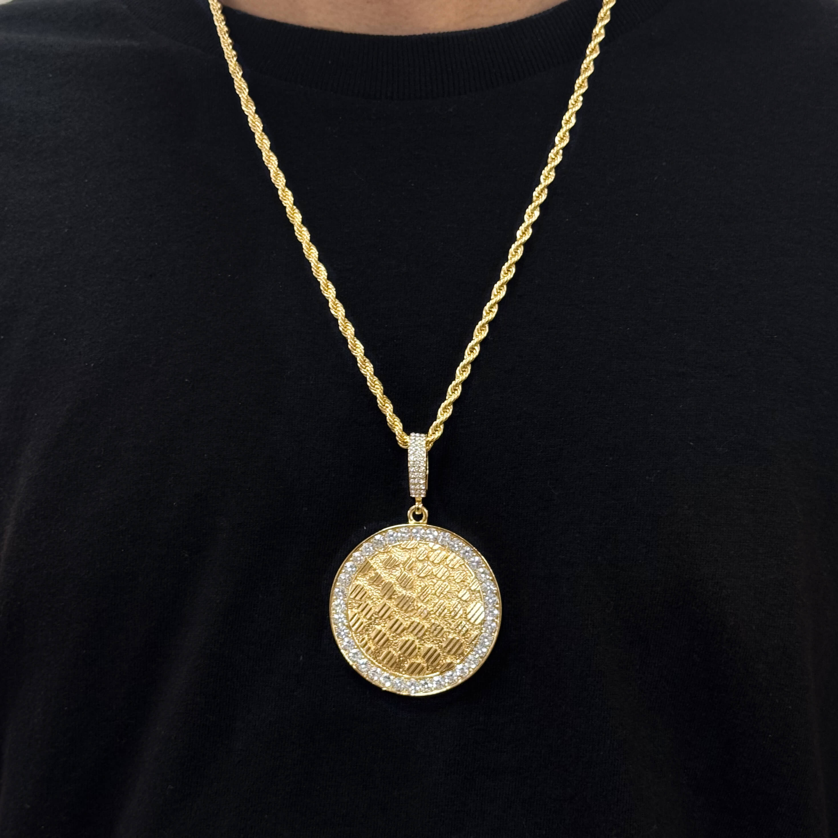 Men's gold iced-out medallion pendant on 8mm rope chain with textured circular design.
