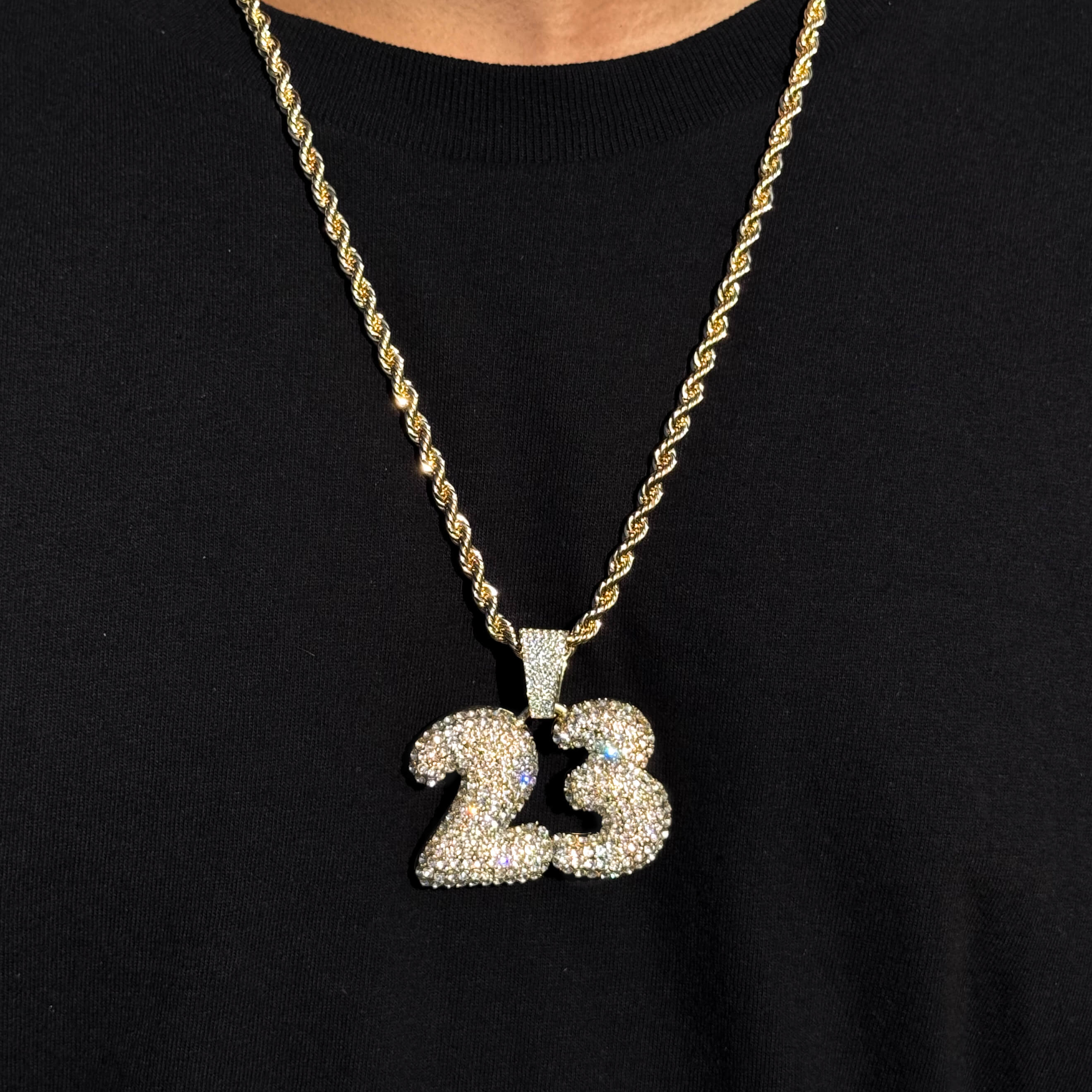 Men's iced out Number 23 pendant on gold 5mm rope chain, sparkling hip hop jewelry for athletes.