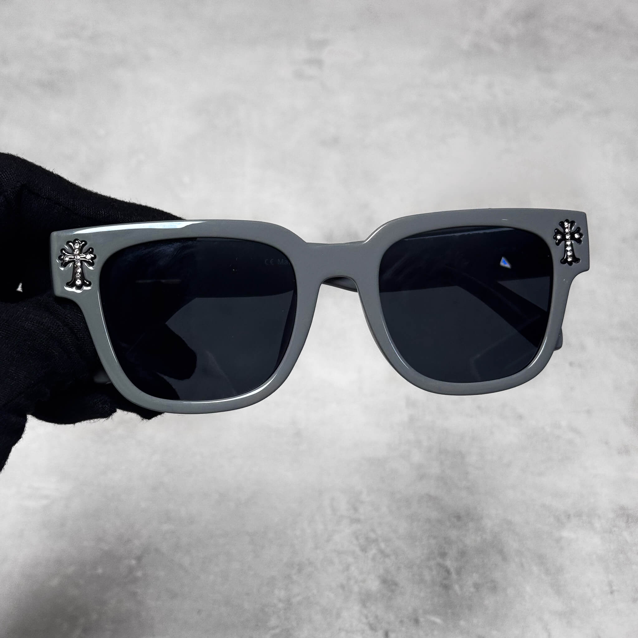 Triple Cross Chrome Inspired Sunglasses in grey frame with black lenses and black cross accents.