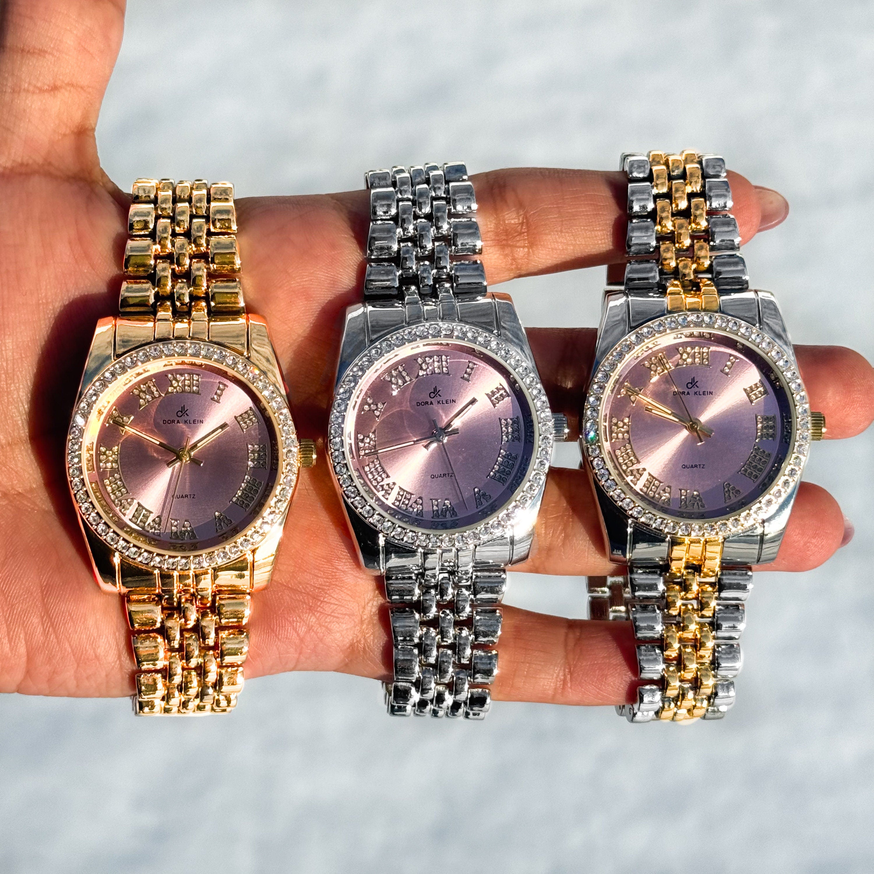 Women's 35mm Roman dial watches in gold, silver and two-tone with diamond-studded bezels.