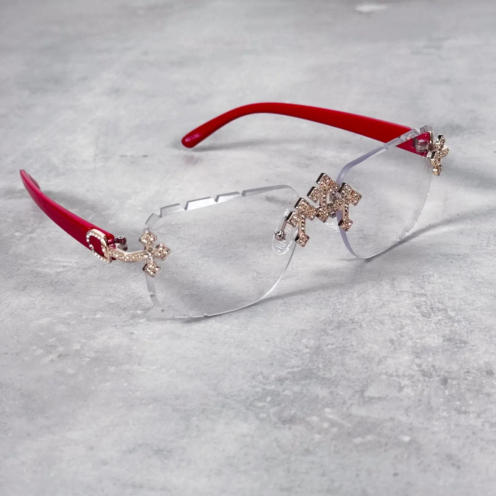 Clear lens Iced Triple Cross Sunglasses with red temples and sparkling crystal cross details.