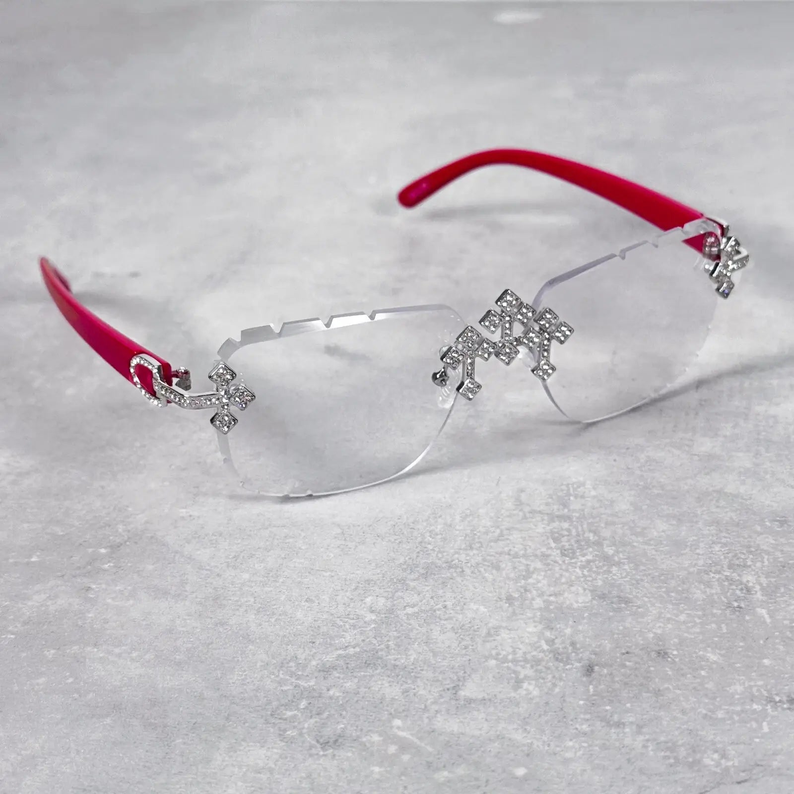 Red-arm Iced Triple Cross Sunglasses with rimless clear lenses and decorative crystal crosses.