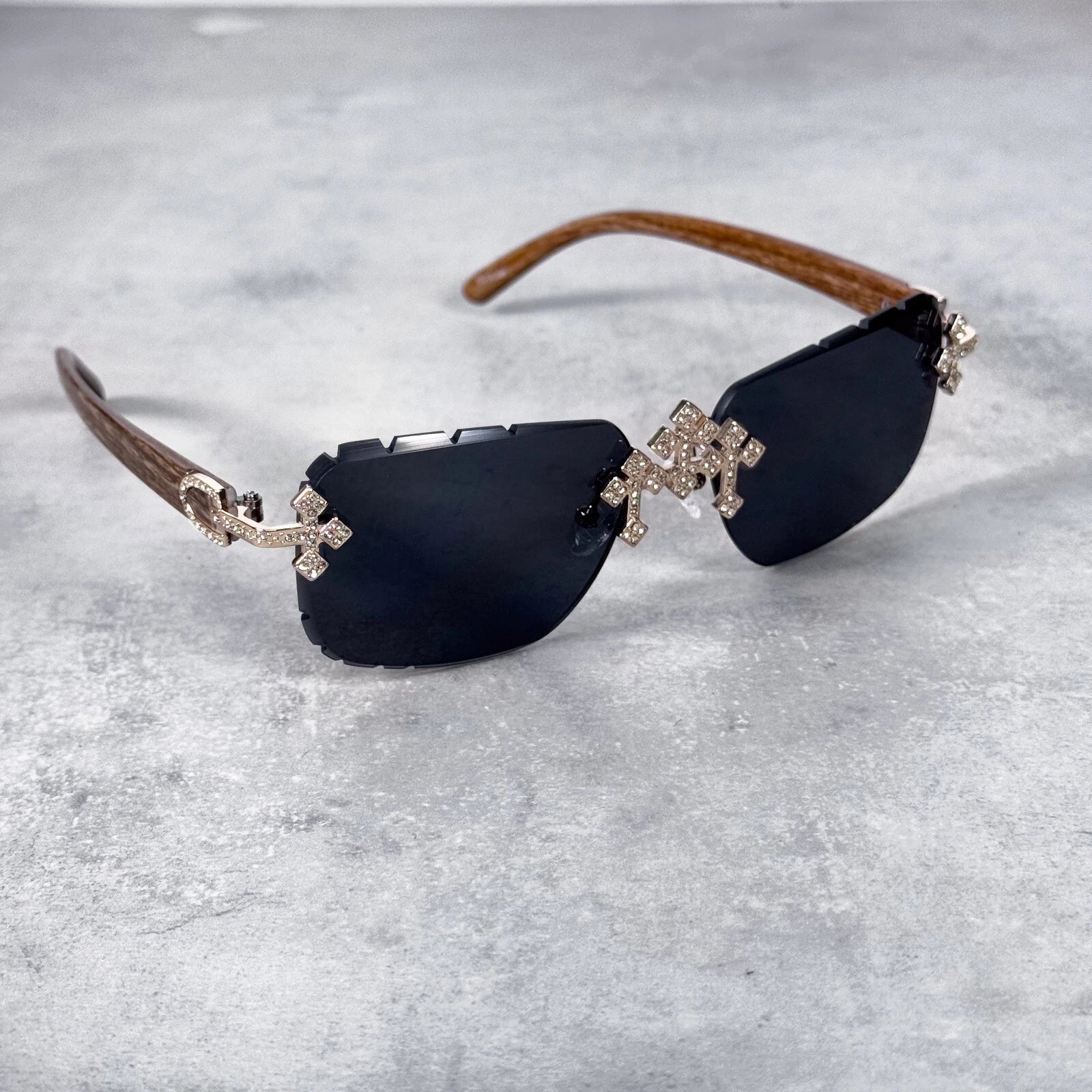 Black-lens Iced Triple Cross Sunglasses with diamond-detailed crosses and wooden temples.