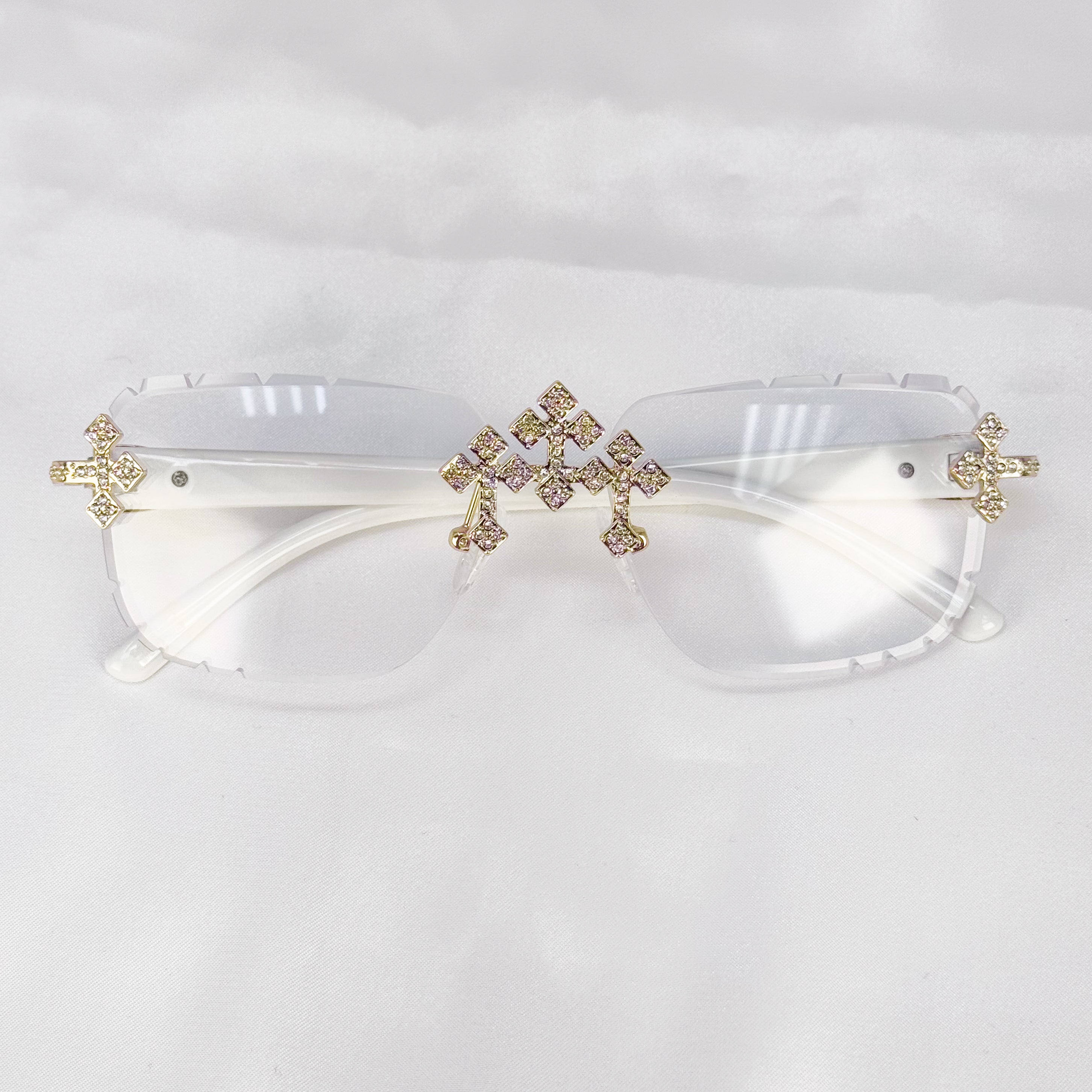 White Iced Triple Cross Sunglasses with clear rimless lenses and gold crystal cross accents.
