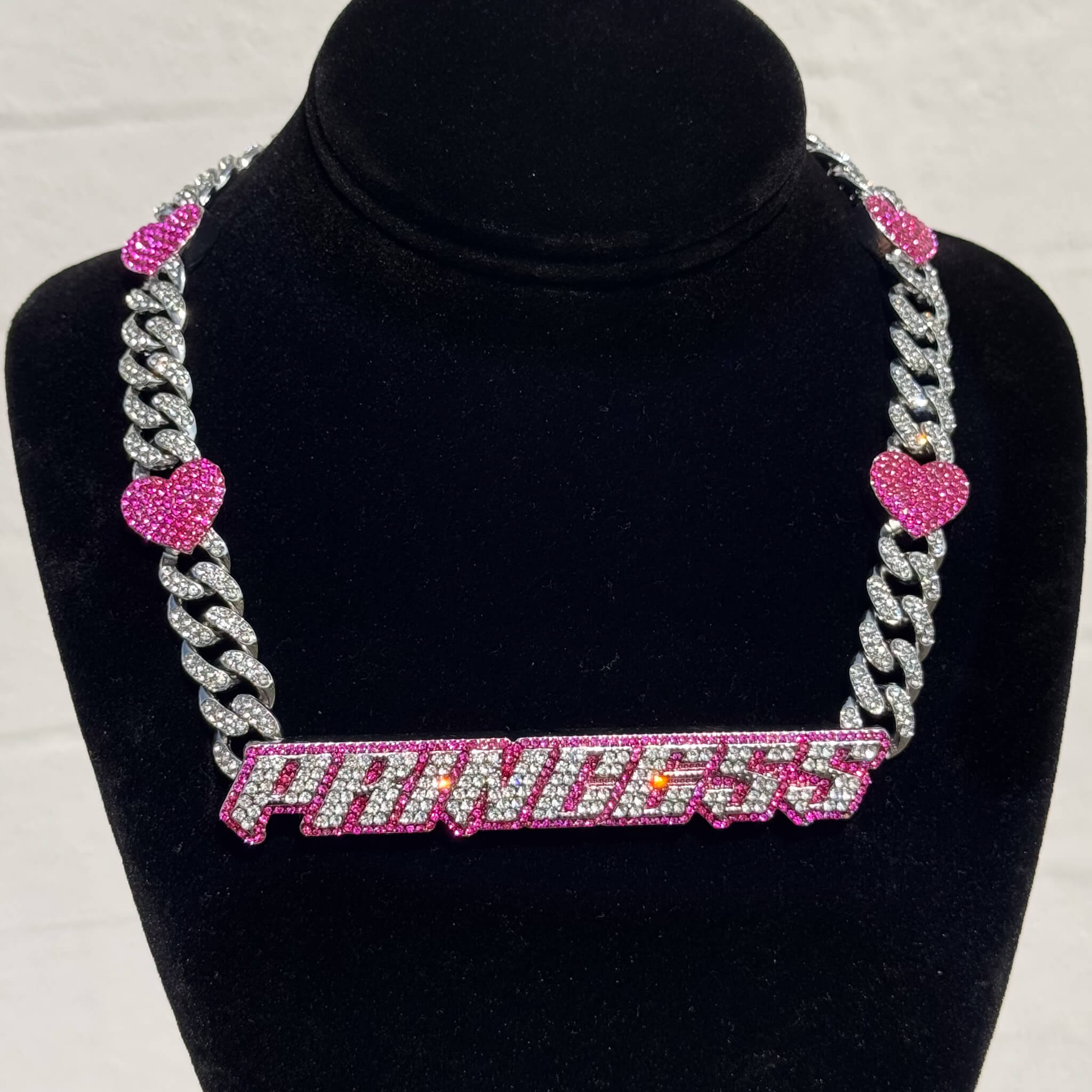 Princess Pink Heart Cuban Choker with iced silver links and sparkling pink heart accents on display.