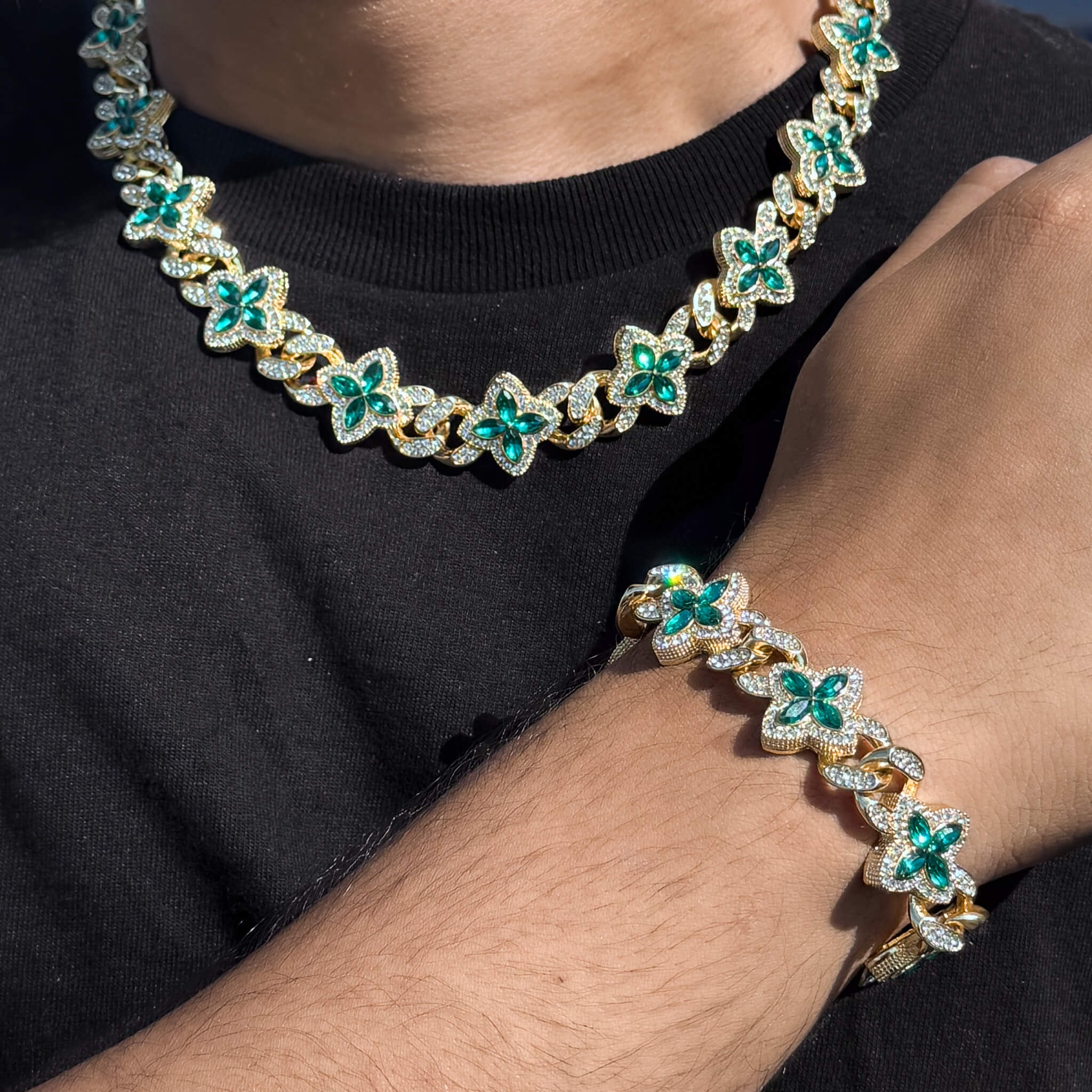 Gold 2-piece iced clover necklace and bracelet set with sparkling Green stones and clover links.