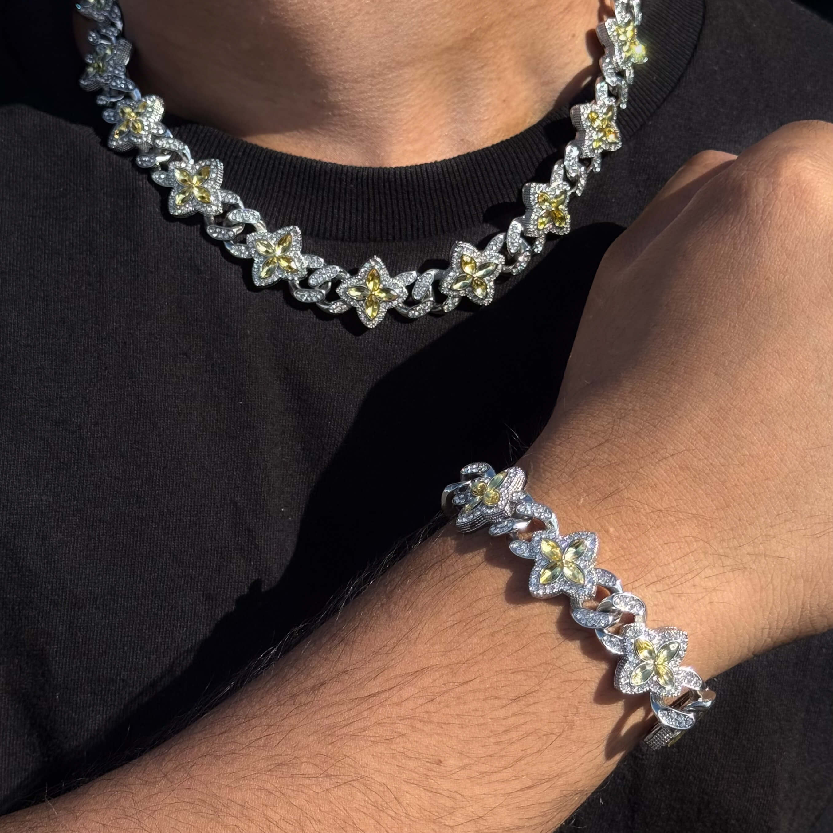 Silver 2-piece iced clover necklace and bracelet set with sparkling Yellow stones and clover links.