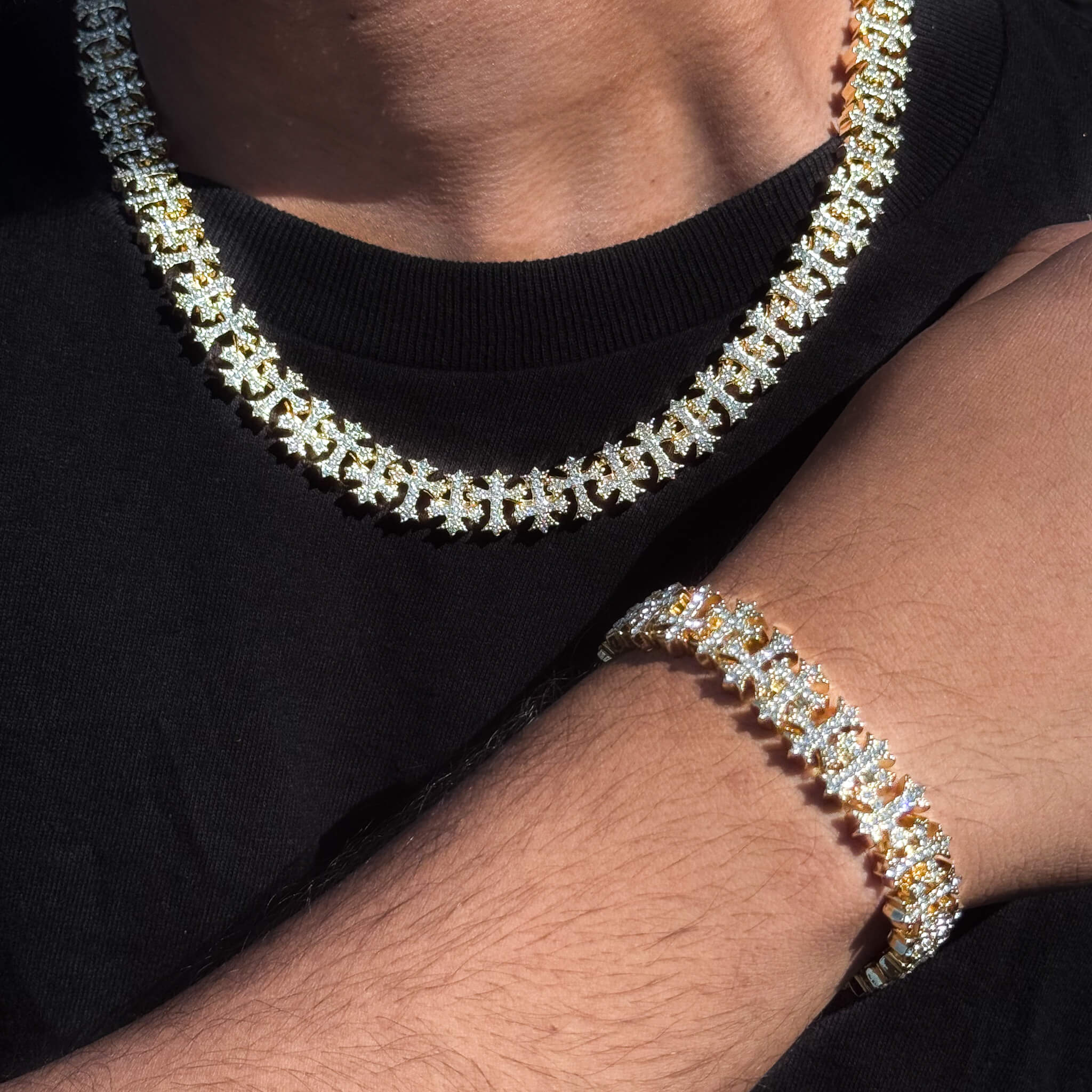 Gold 2-piece iced Cross necklace and bracelet set with sparkling Clear stones and clover links.