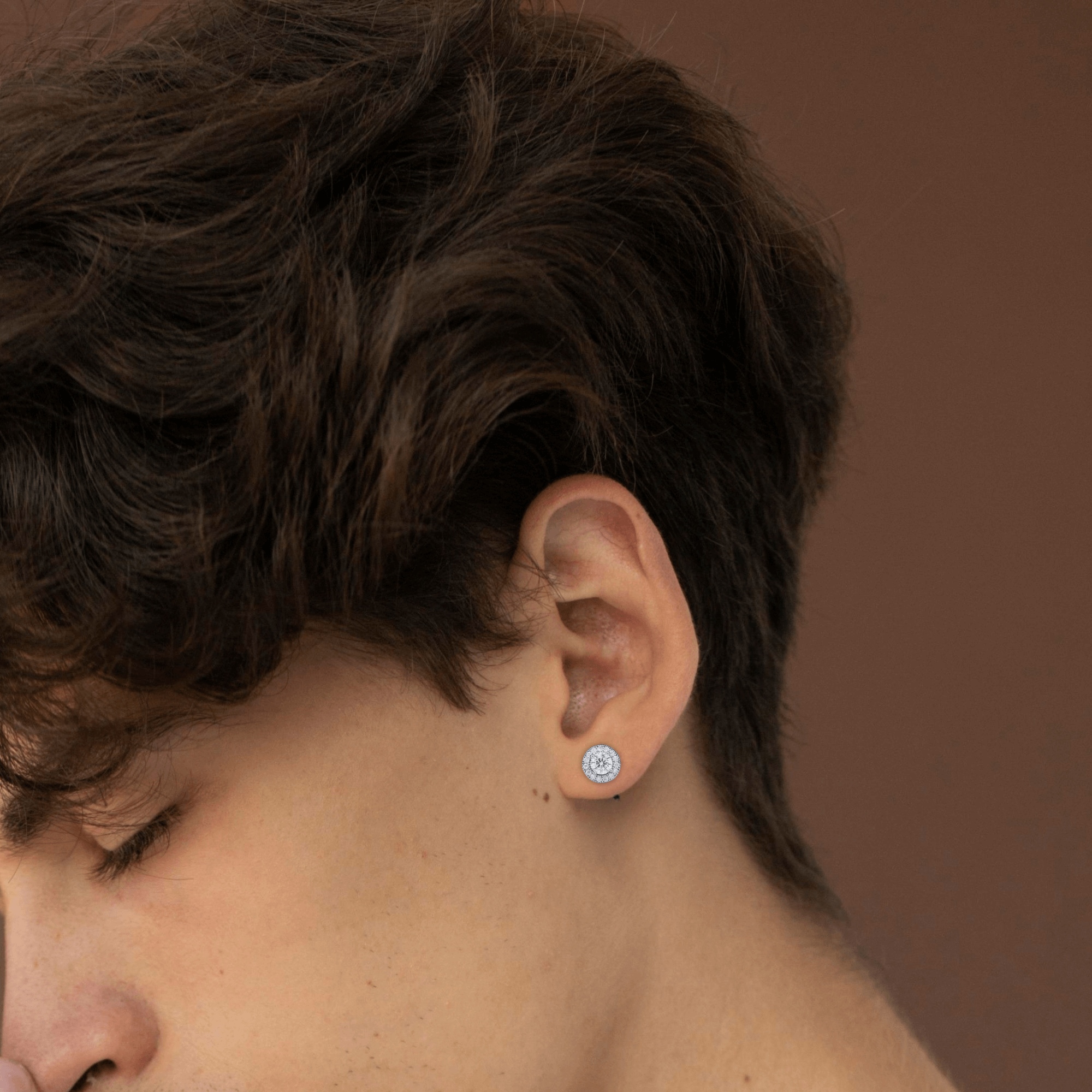 7mm round moissanite cluster diamond stud earring worn on ear.