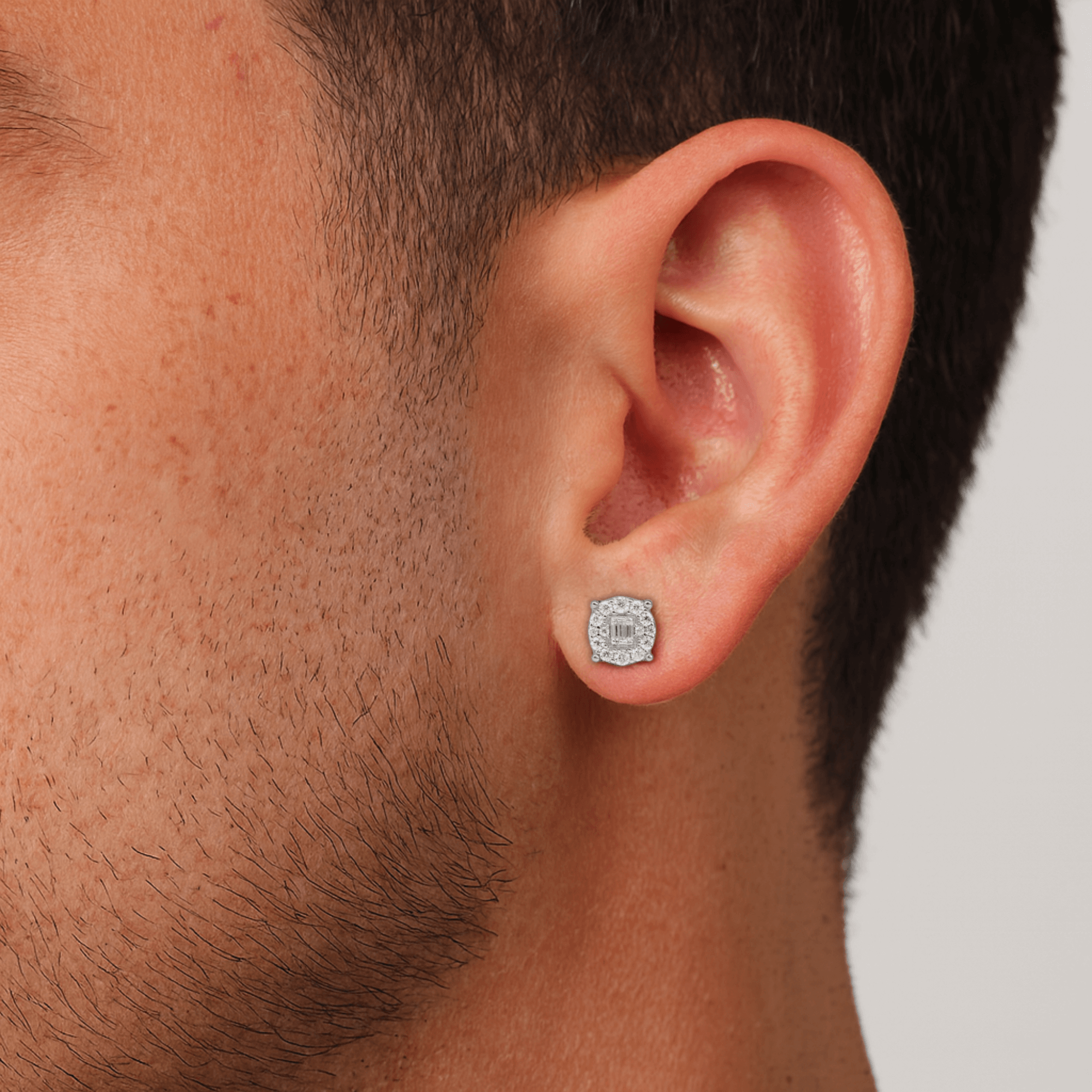 Round moissanite cluster diamond stud earring worn on ear, showing 7mm size and shine.