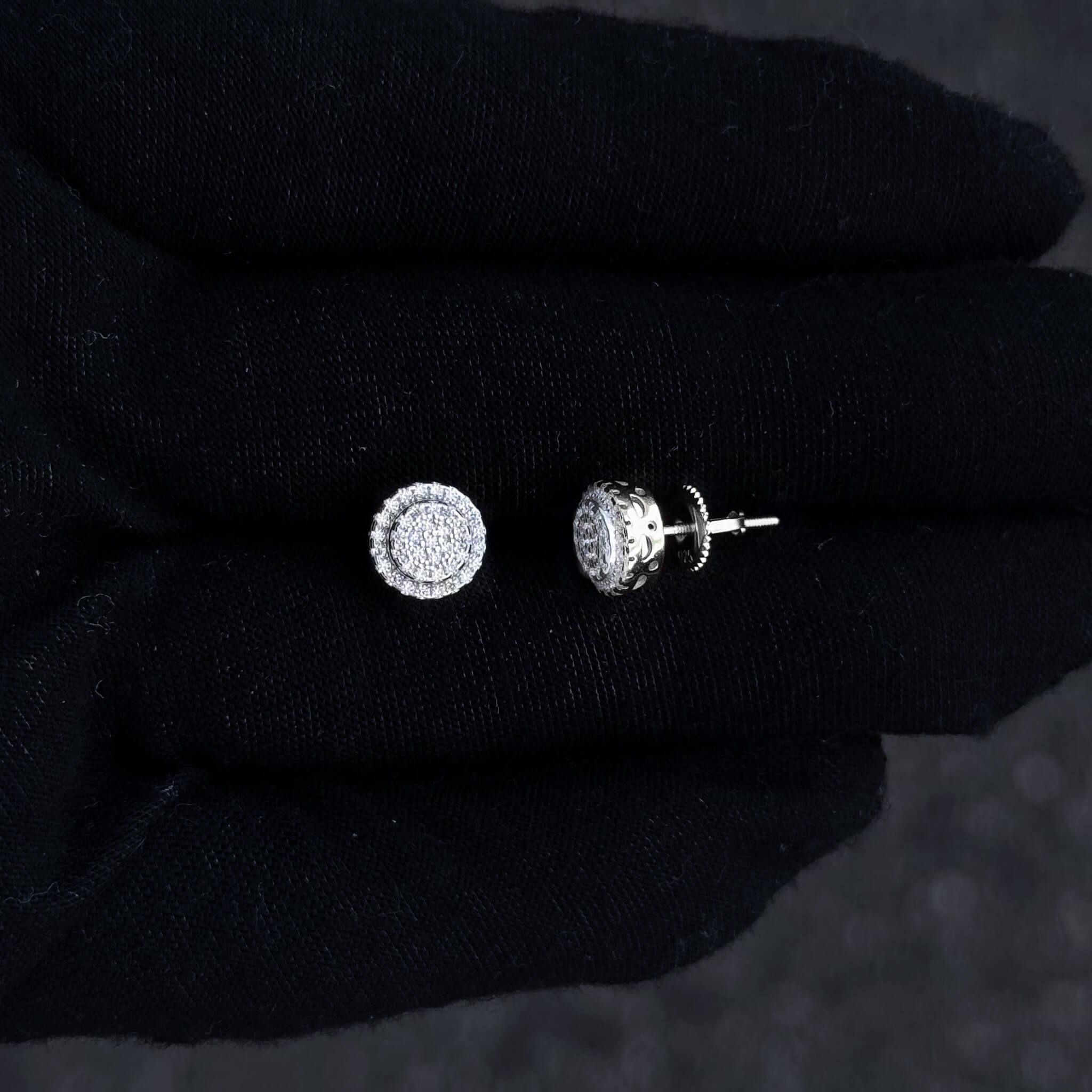Close-up of 8mm moissanite cluster stud and screw-back post in sterling silver double-halo setting.