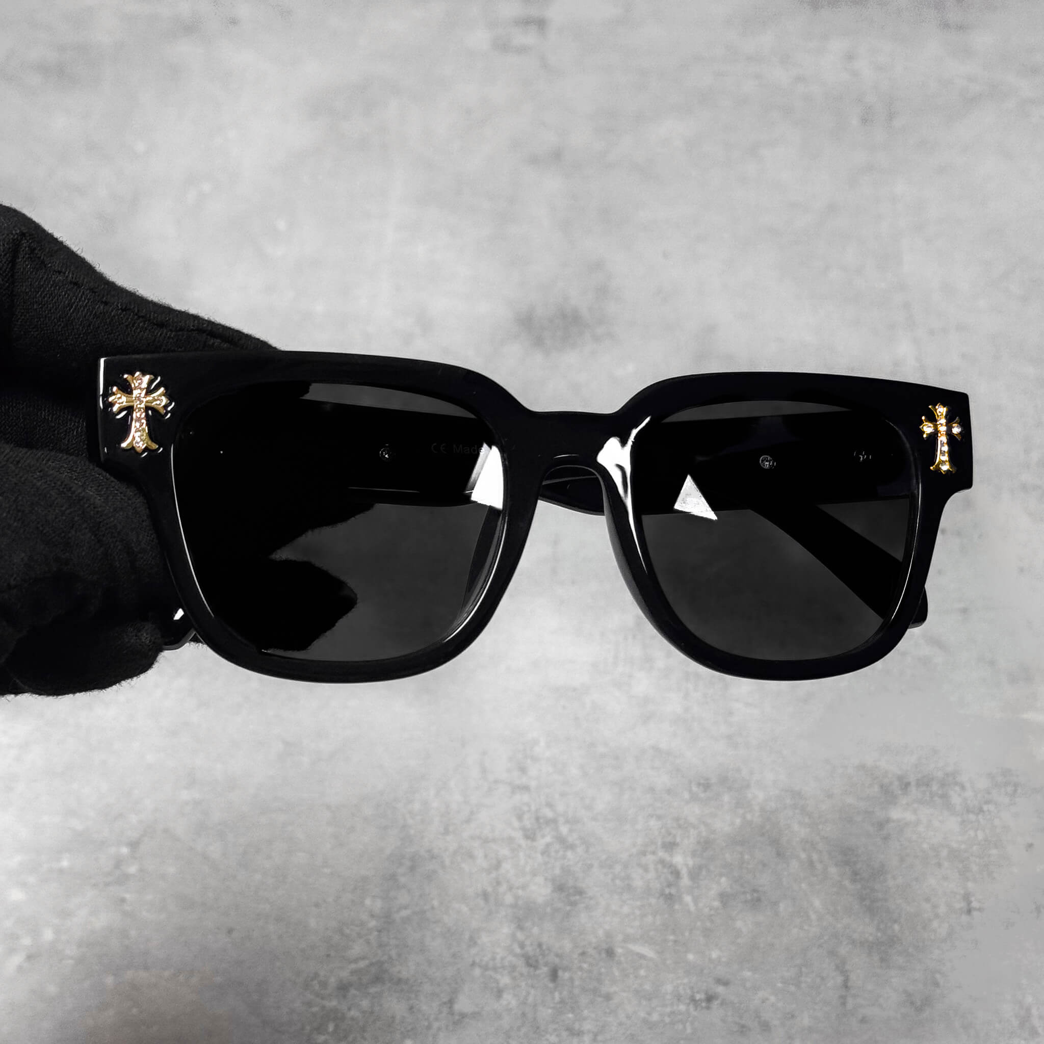 Front view of black Triple Cross Chrome Inspired Sunglasses with gold chrome cross accents.