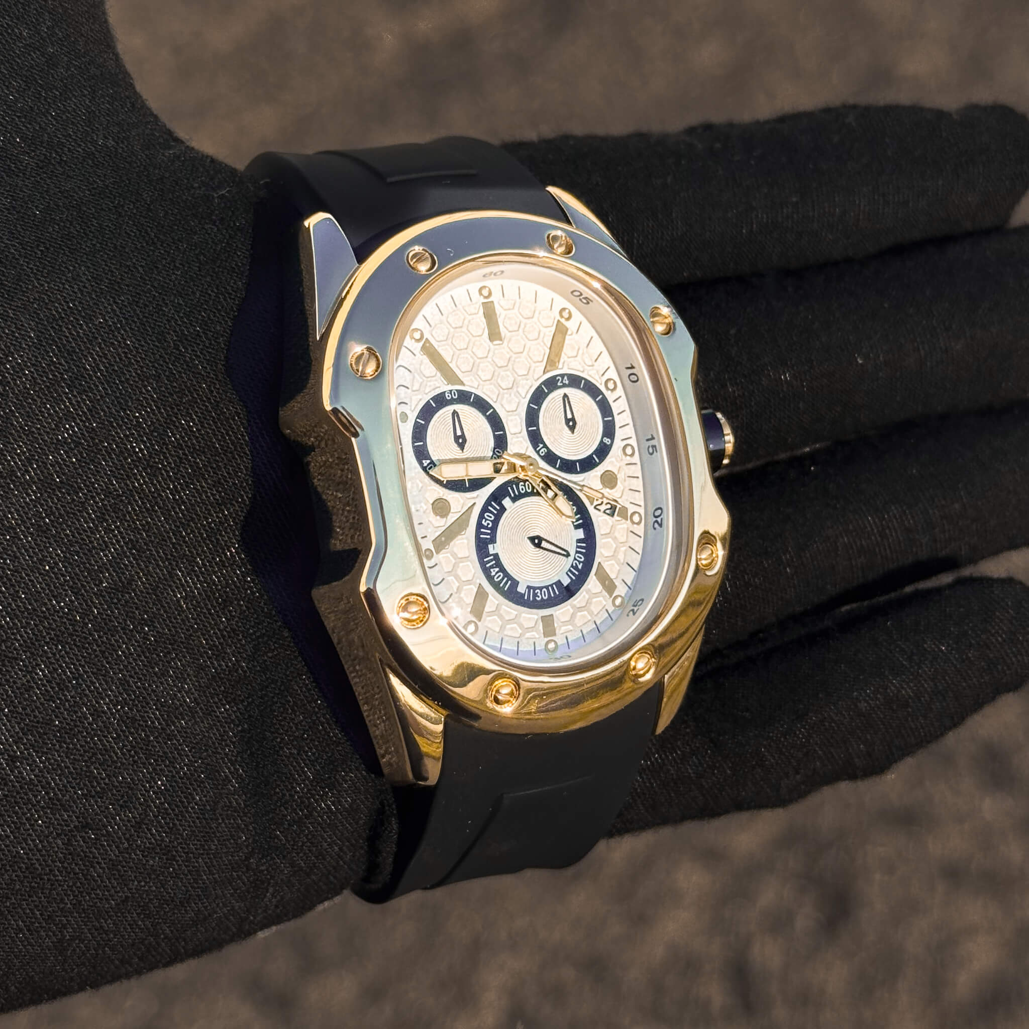 Side profile of gold Men’s 40mm Classic Watch featuring white dial and black accents.