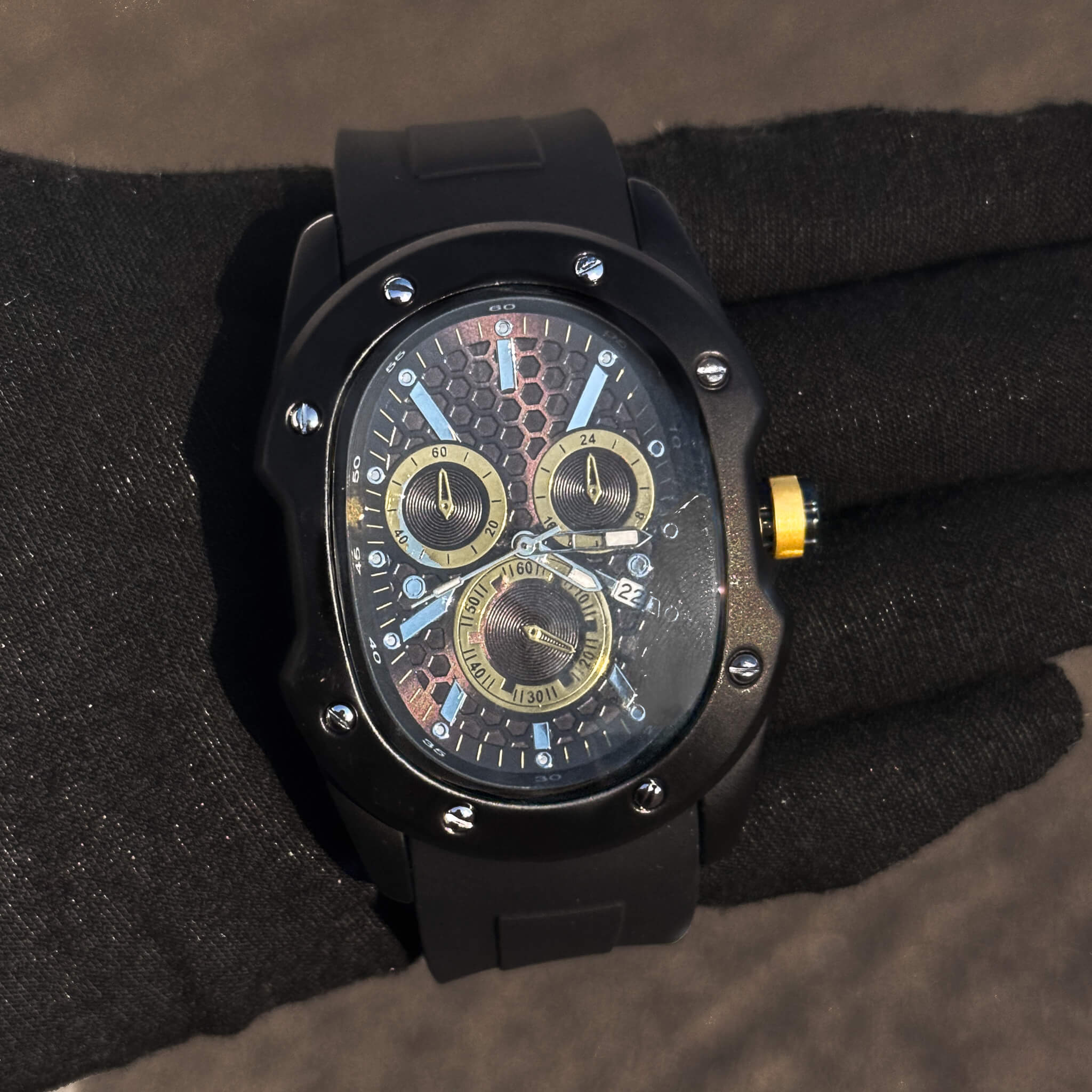 Men’s 40mm Classic Black Watch with gold-accented honeycomb dial and matte black silicone band.