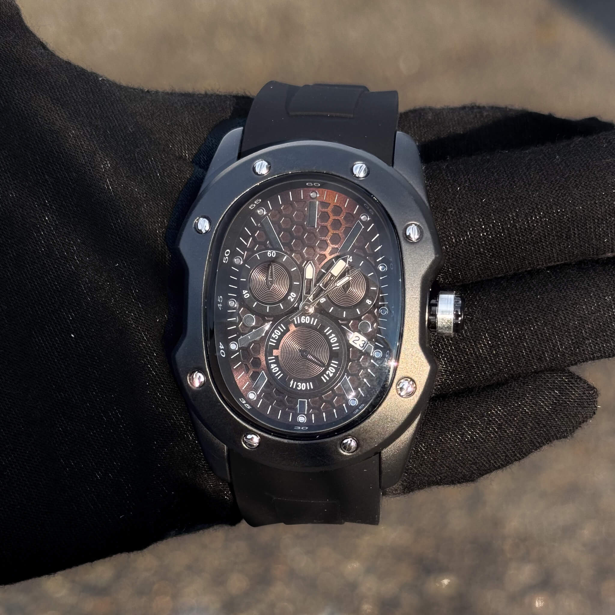 Men’s 40mm Classic Black Watch with bronze honeycomb dial, black case, and date display.