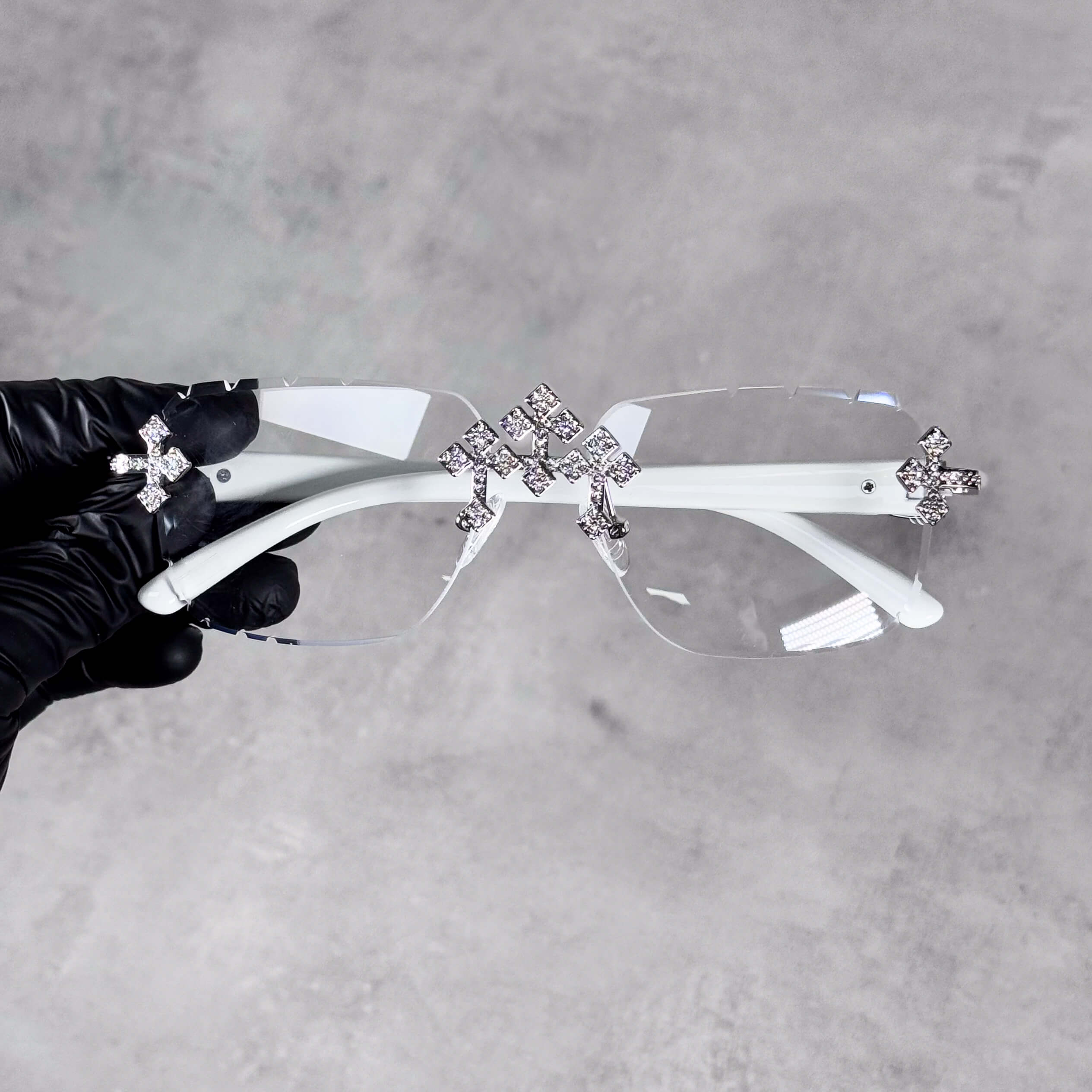 White Iced Triple Cross Sunglasses with clear lenses and silver crystal cross embellishments.