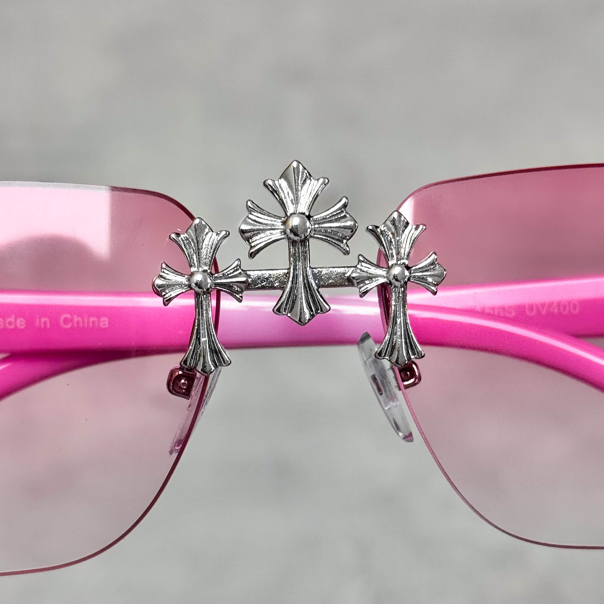 Pink gradient Solid Triple Cross Sunglasses showcasing silver triple cross bridge detailing.