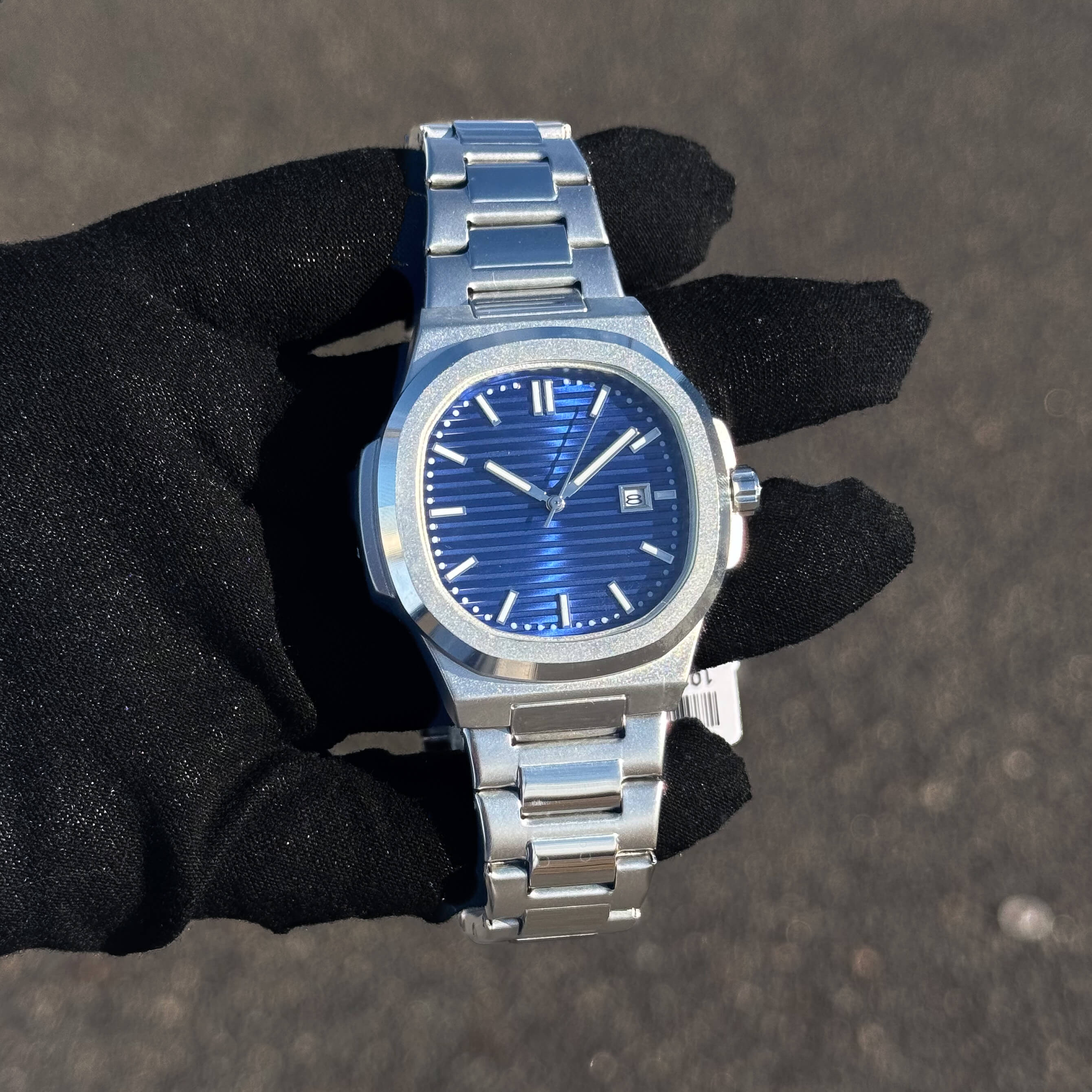 Men’s 42mm Classic Oblong Dial Watch with blue striped dial and stainless steel bracelet.