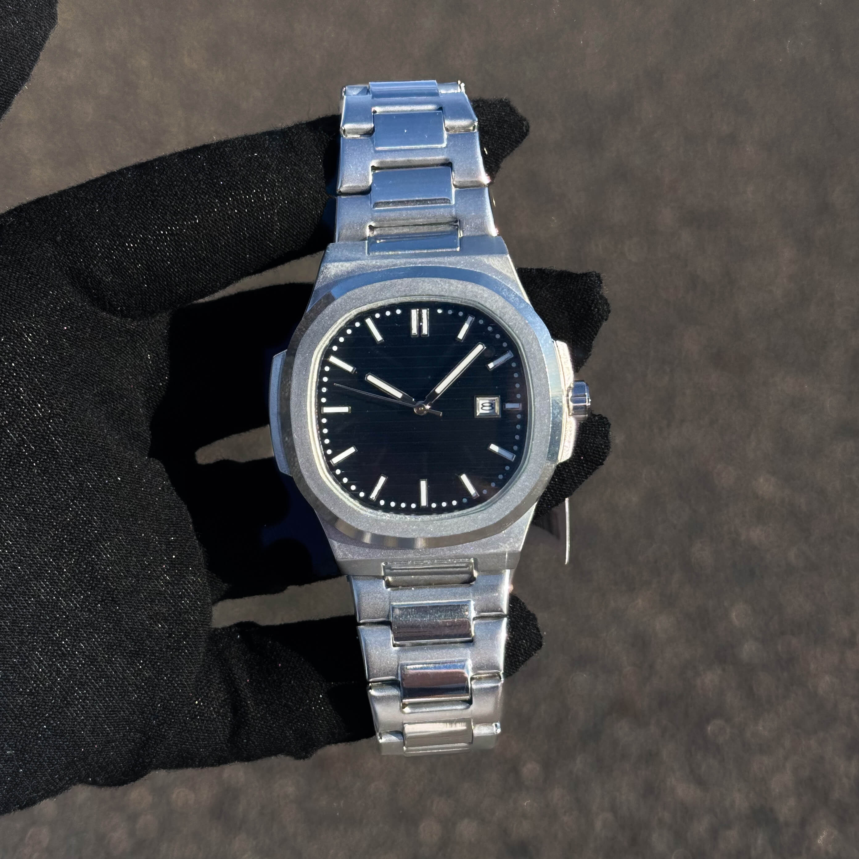 Men’s 42mm Classic Oblong Dial Watch with black textured dial and stainless steel bracelet.