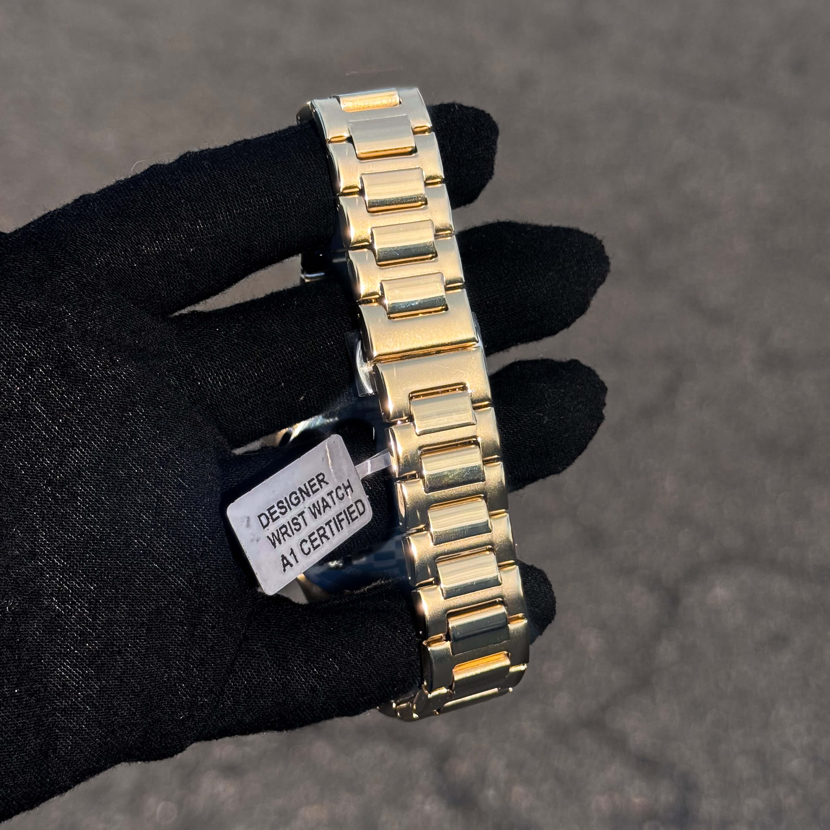 Men’s 42mm Classic Oblong Dial Watch showing gold finish stainless steel link bracelet detail.