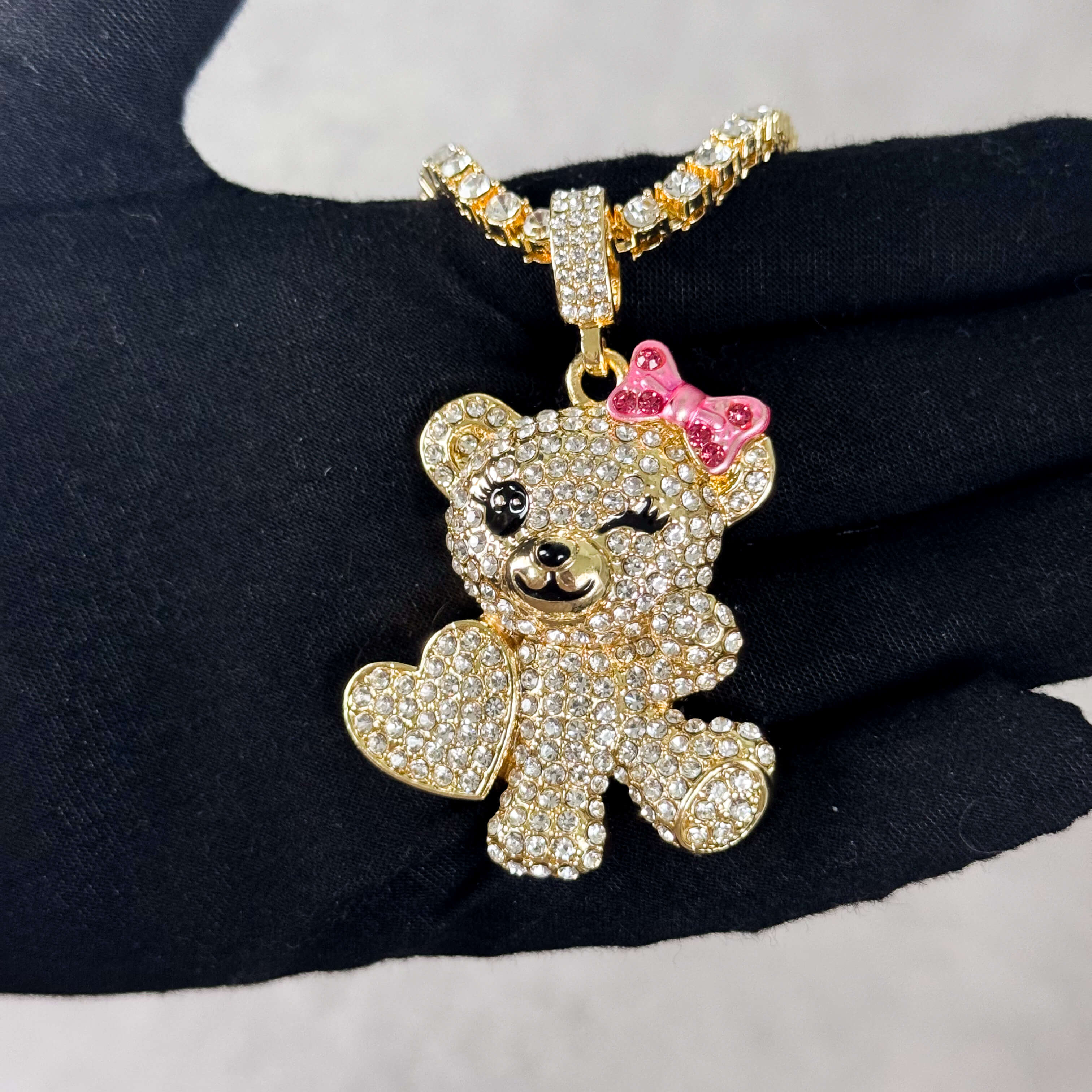 Gold Iced Out Flirty Bear Pendant with tennis chain, winking bear design, pink bow detail..