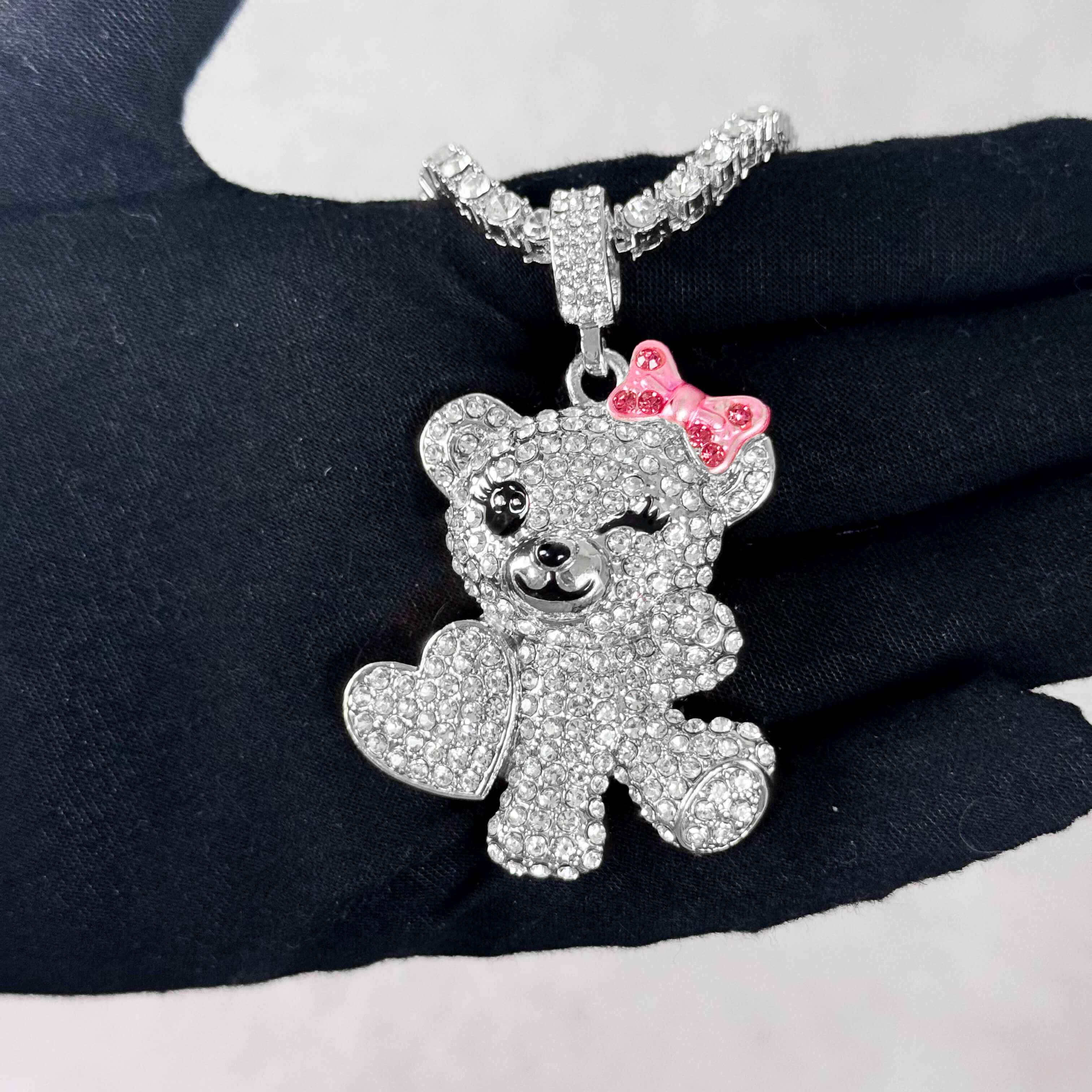 Silver Iced Out Flirty Bear Pendant with tennis chain, sparkling crystals and pink bow.