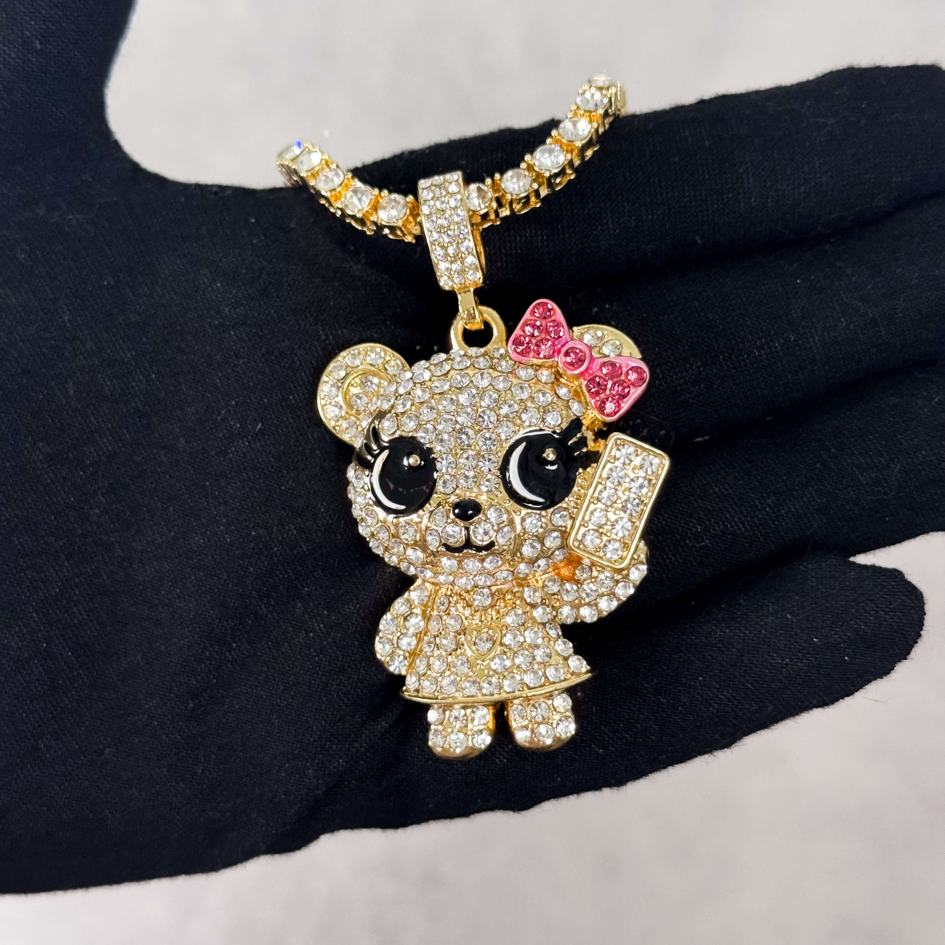 Gold Iced Out Call Me Bear Pendant with tennis chain, sparkling crystals and pink bow.