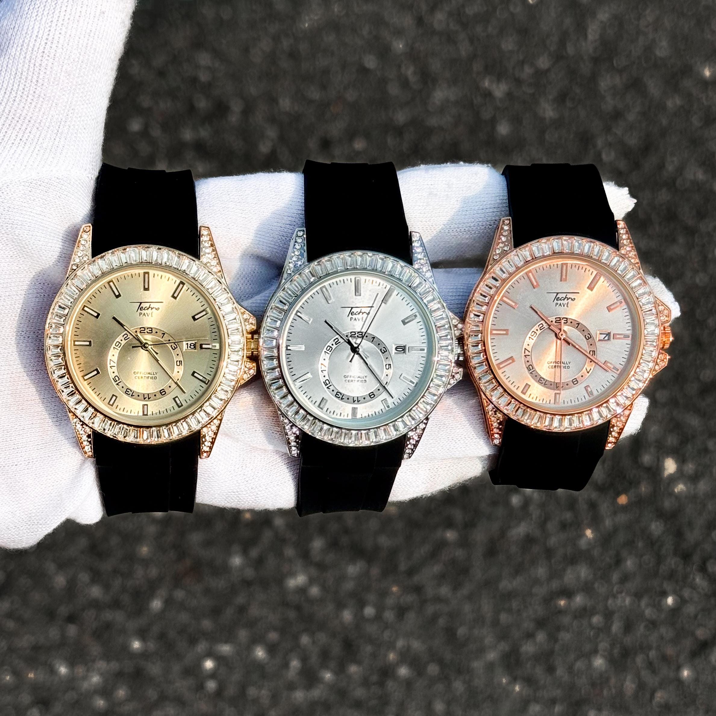 Men’s 42mm diamond watches with silicone bands and baguette bezels shown in gold, silver, and rose gold.