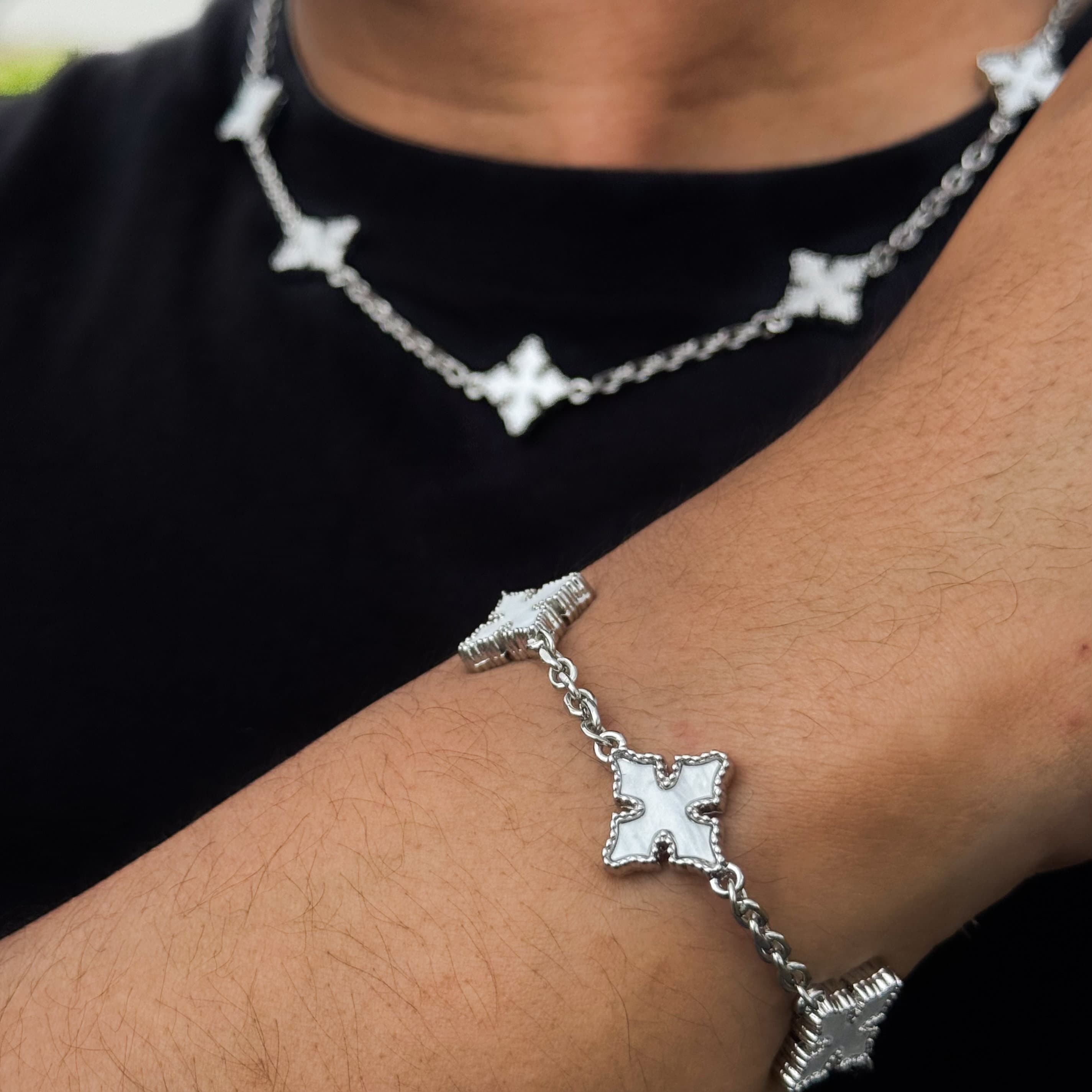 Men’s chrome-inspired multi-cross necklace and bracelet set with white double-sided charms.