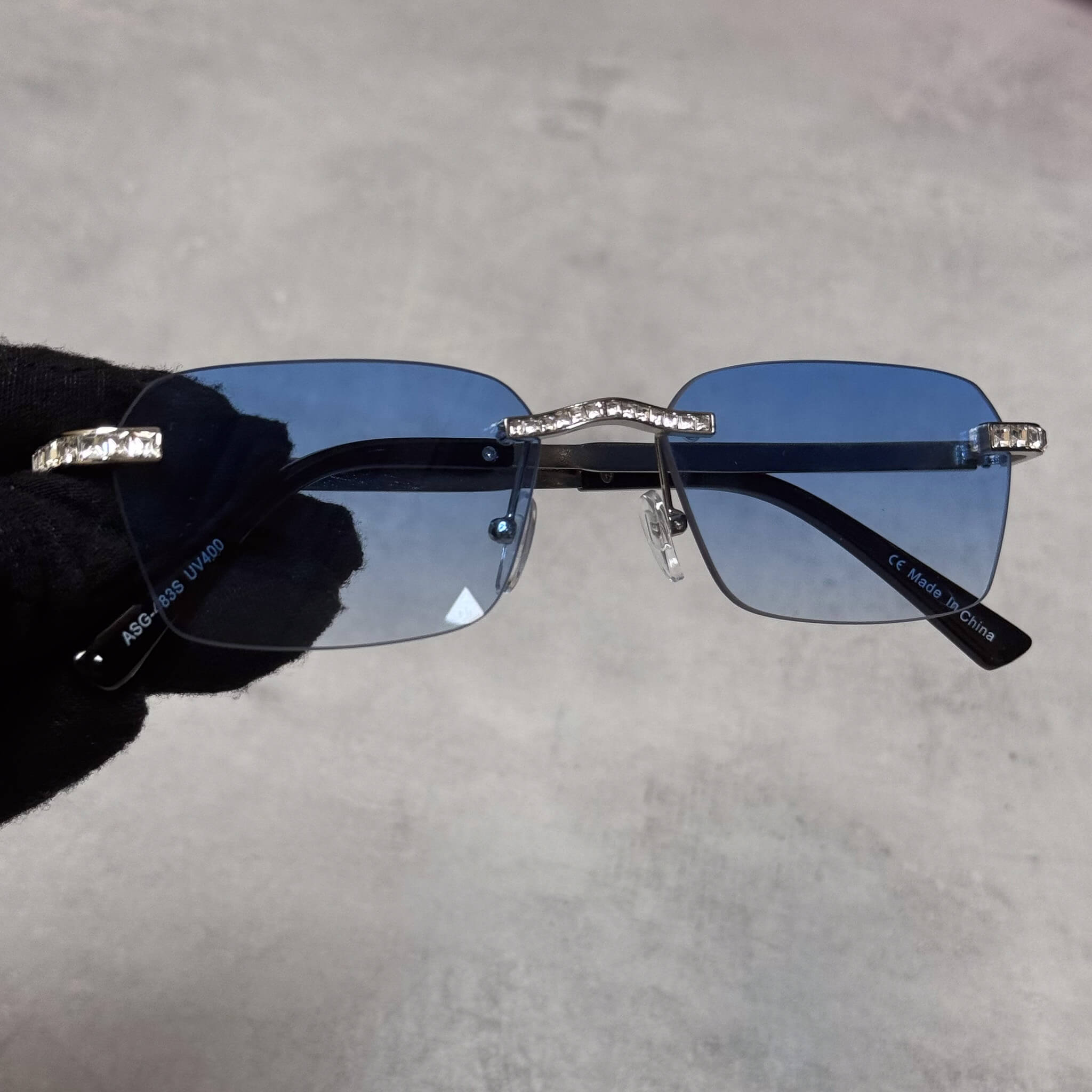 Baguette Stone Sunglasses with blue square lenses and crystal-trimmed silver frame front view.