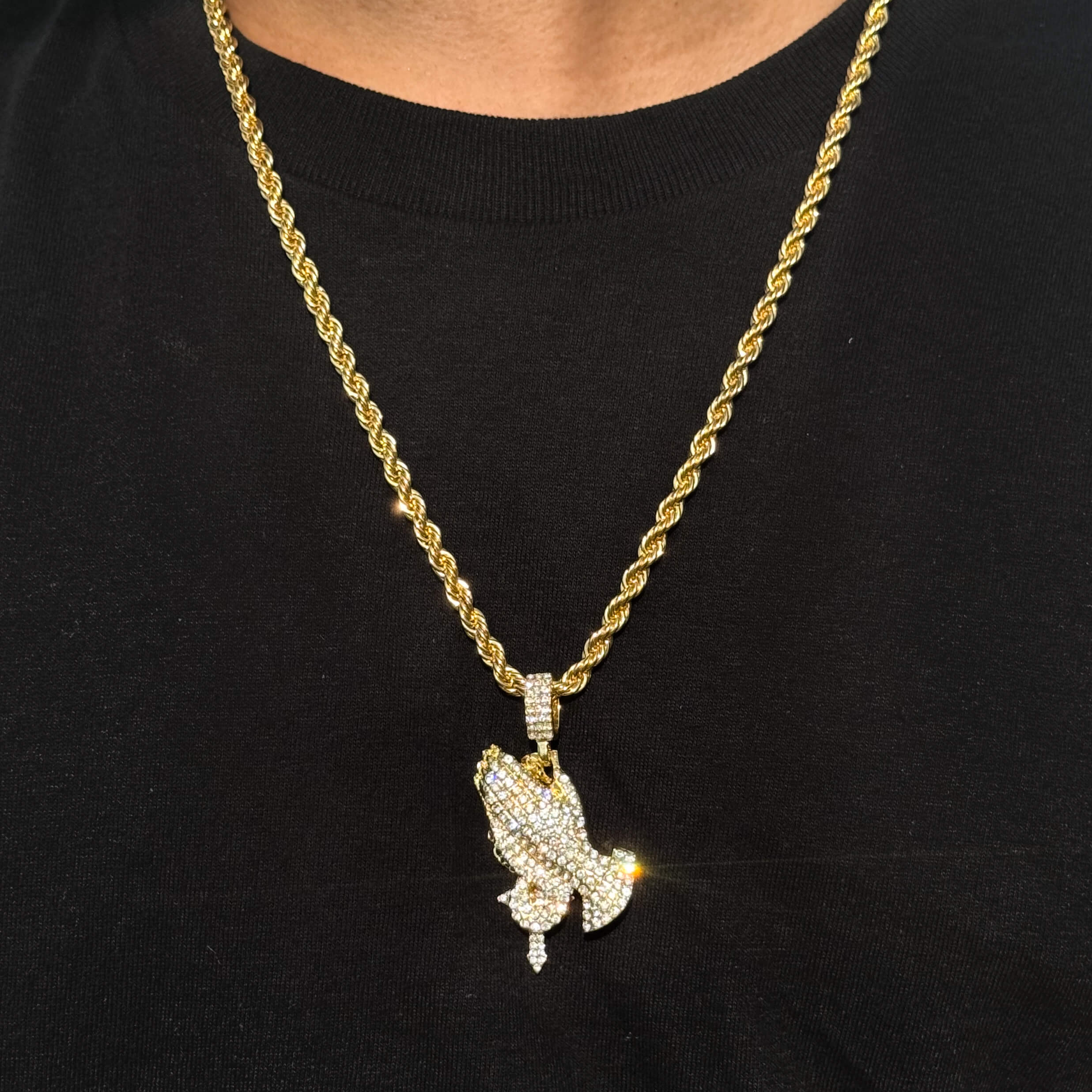 Men's gold iced out praying hands pendant with cross on 4mm rope necklace, sparkling stones.