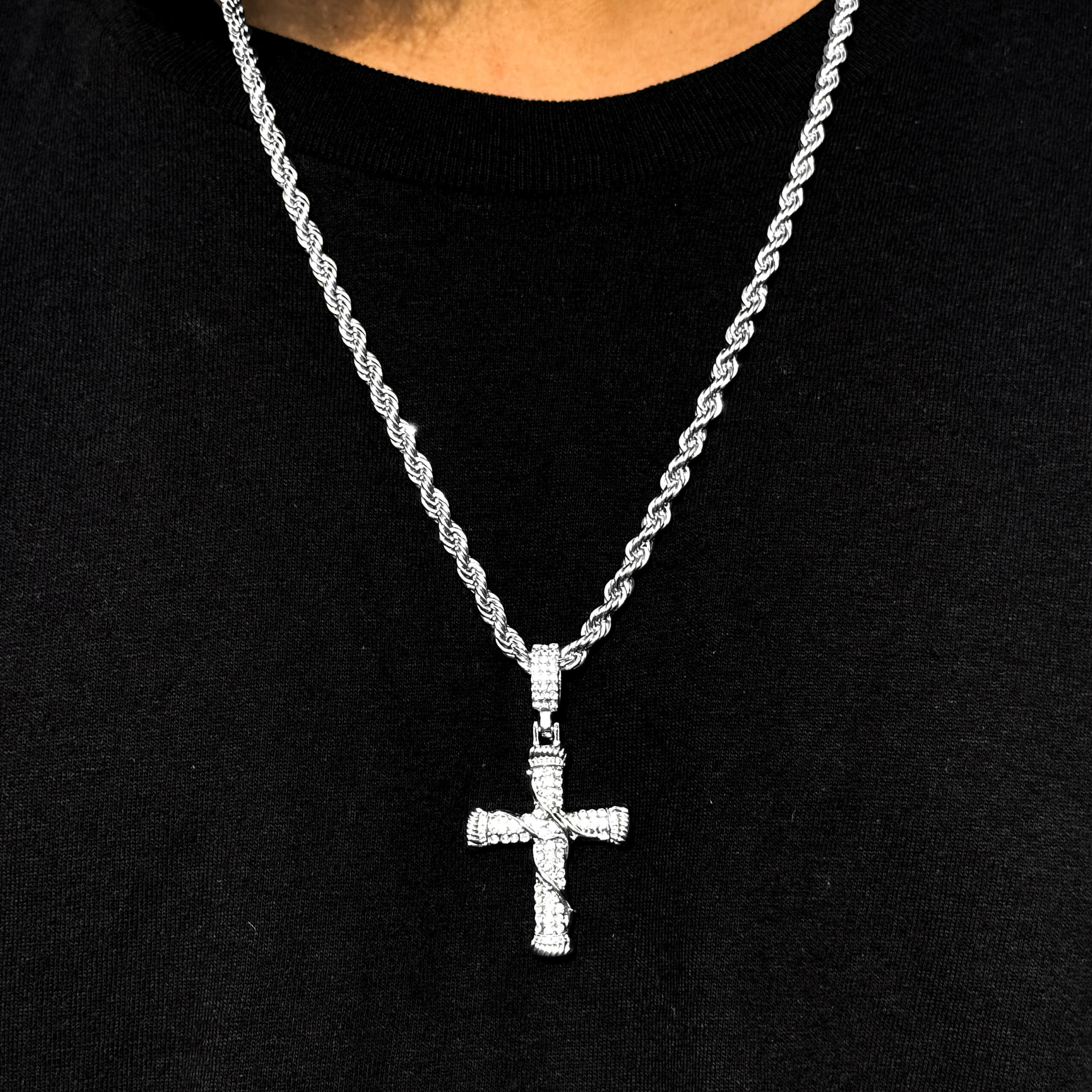 Men's silver iced out thorn cross pendant on 4mm rope necklace with sparkling stones.