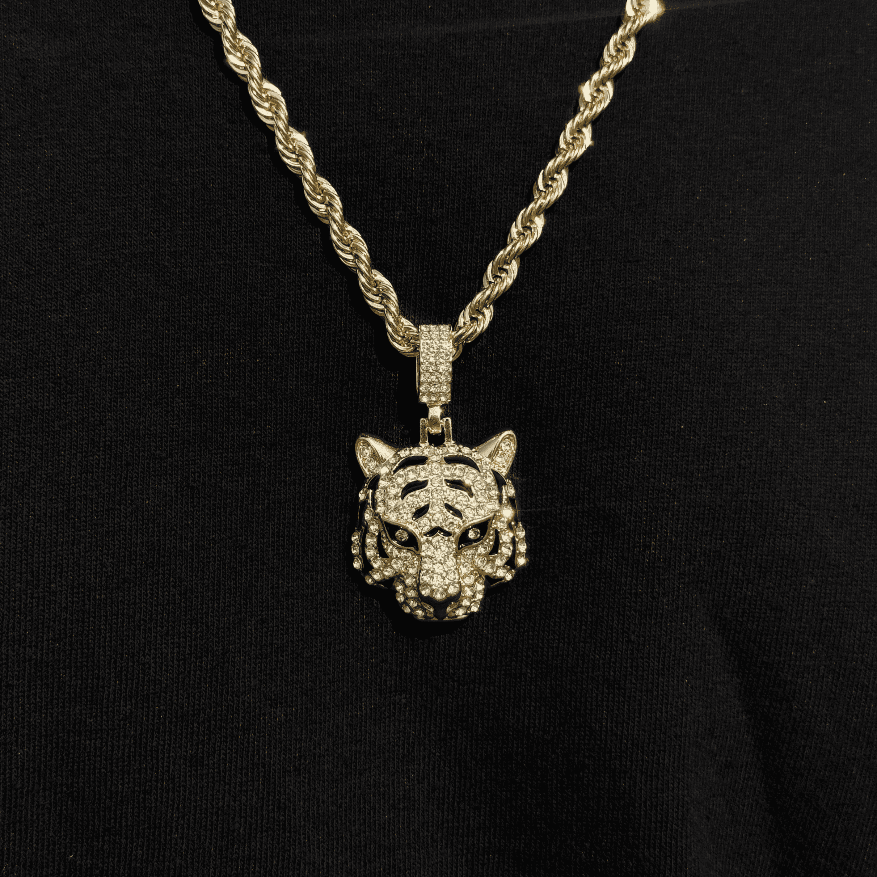 Men's iced out tiger pendant with gold 4mm rope necklace featuring detailed crystal accents.