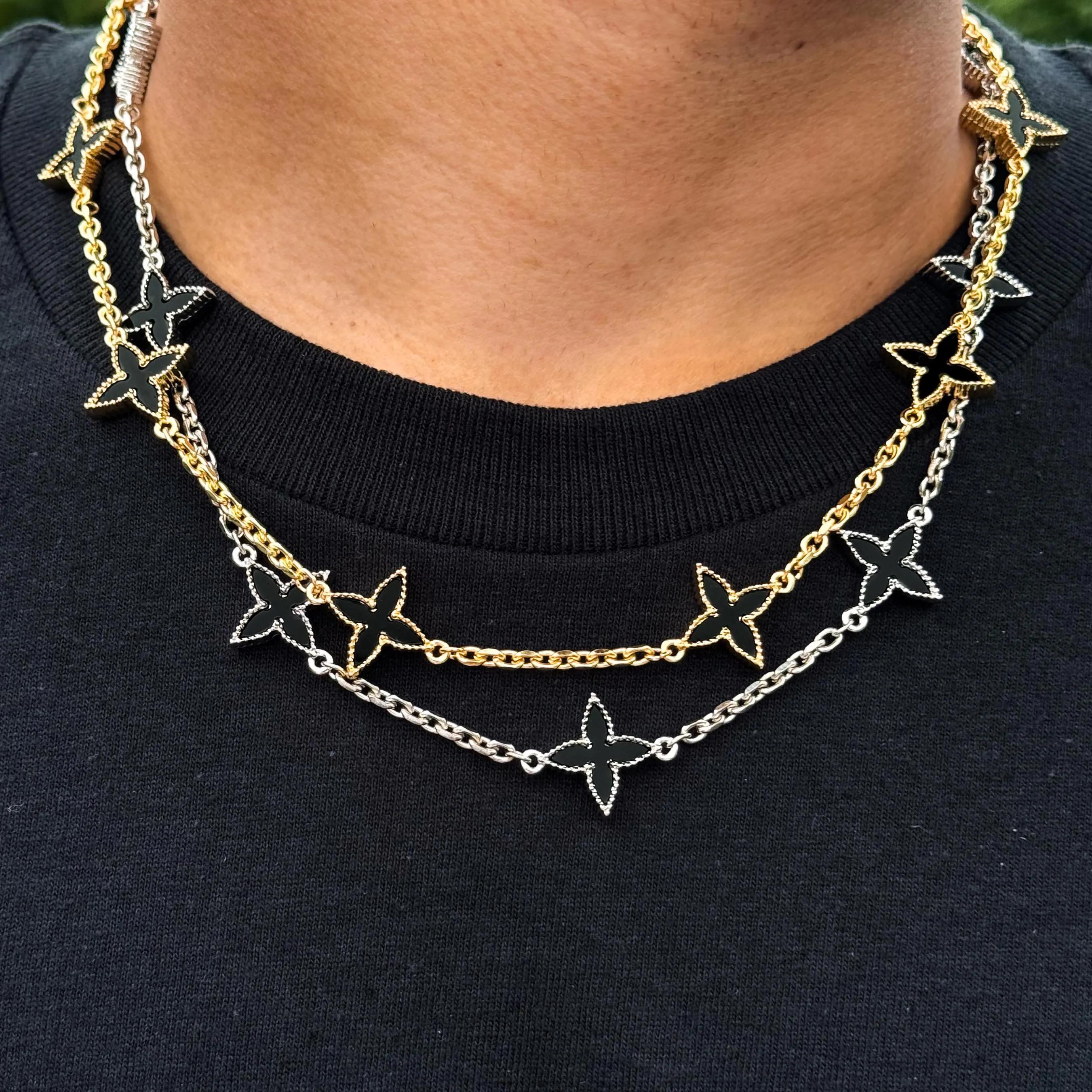 Men’s 18mm Louis inspired Black Multi Charm Necklace layered in gold and silver with double-sided black star charms, worn close-up.
