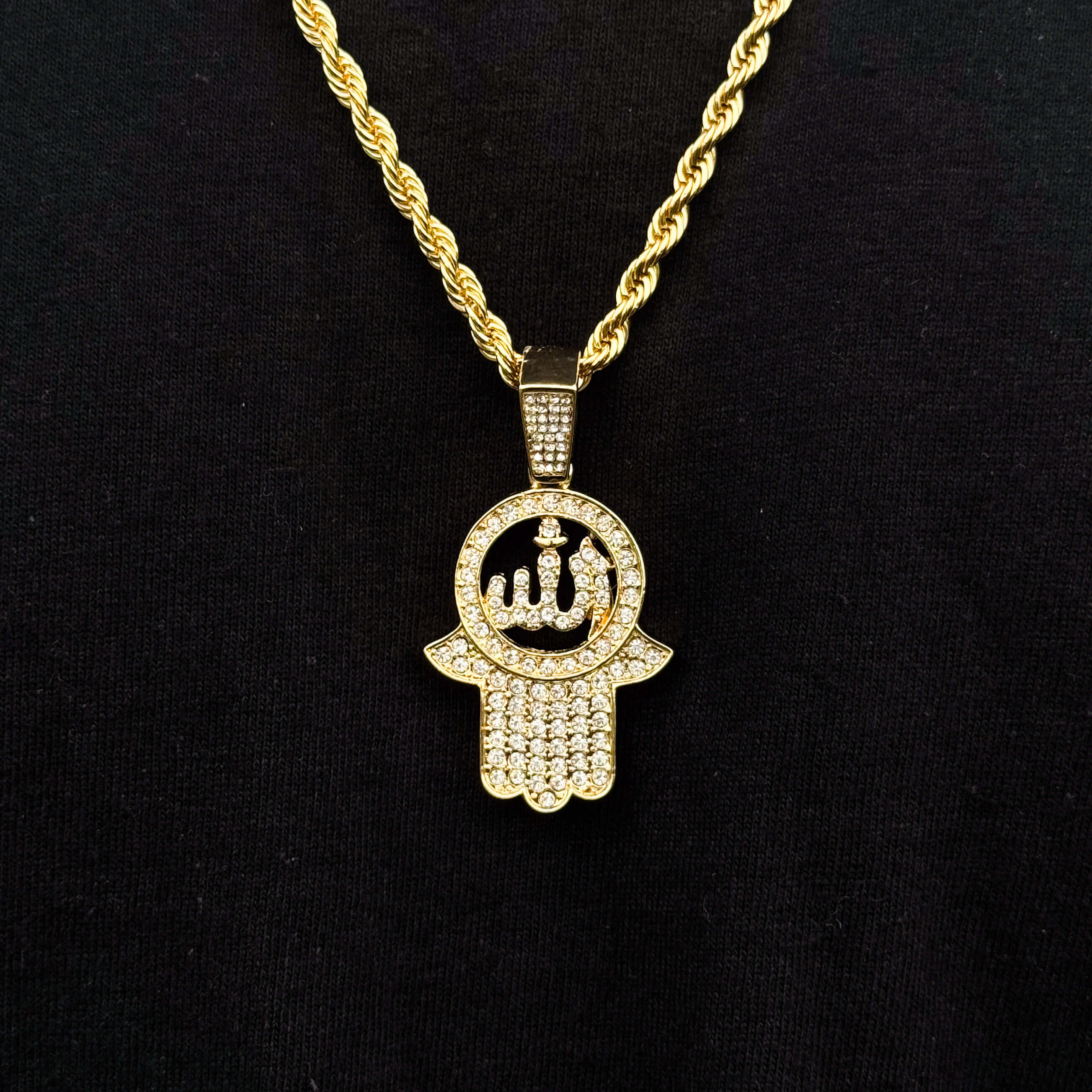 Gold men's Islamic pendant necklace with crystal-paved Hamsa design on 4mm rope chain.