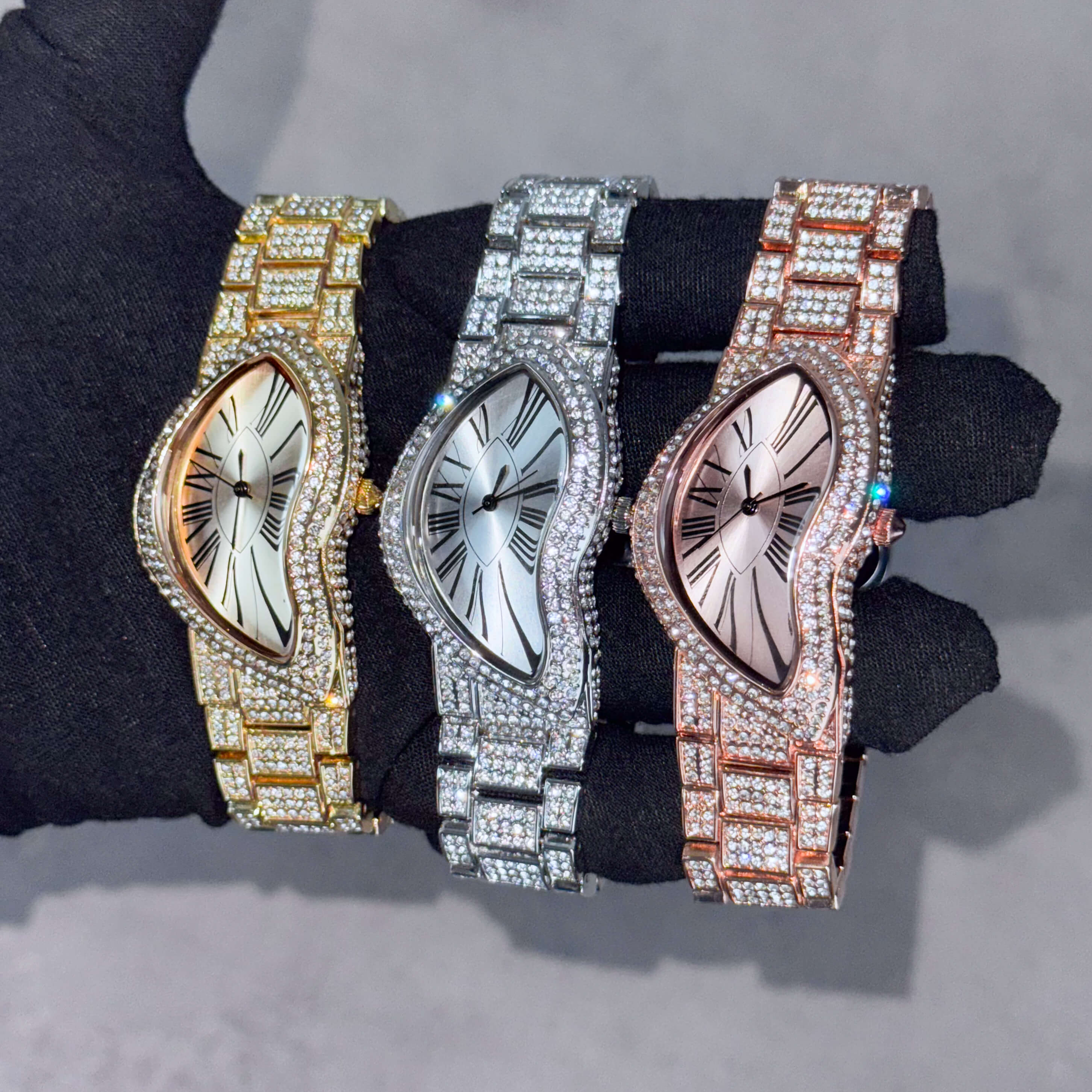 Men’s 30mm fully iced-out warped watch set in gold, silver and rose gold with crystal bracelet designs.