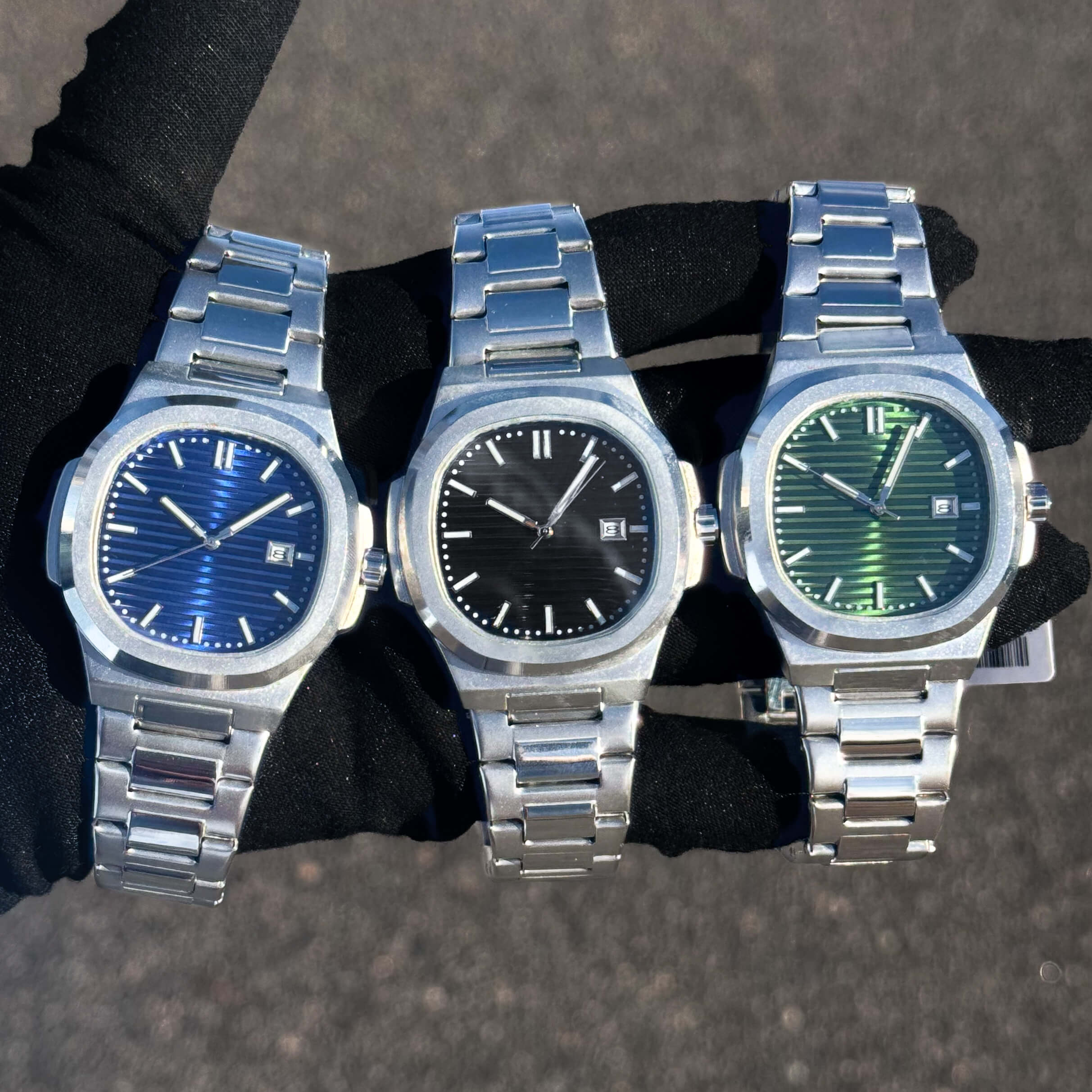 Men’s 42mm Classic Oblong Dial Watch with stainless steel bracelet and blue, black, and green dials.