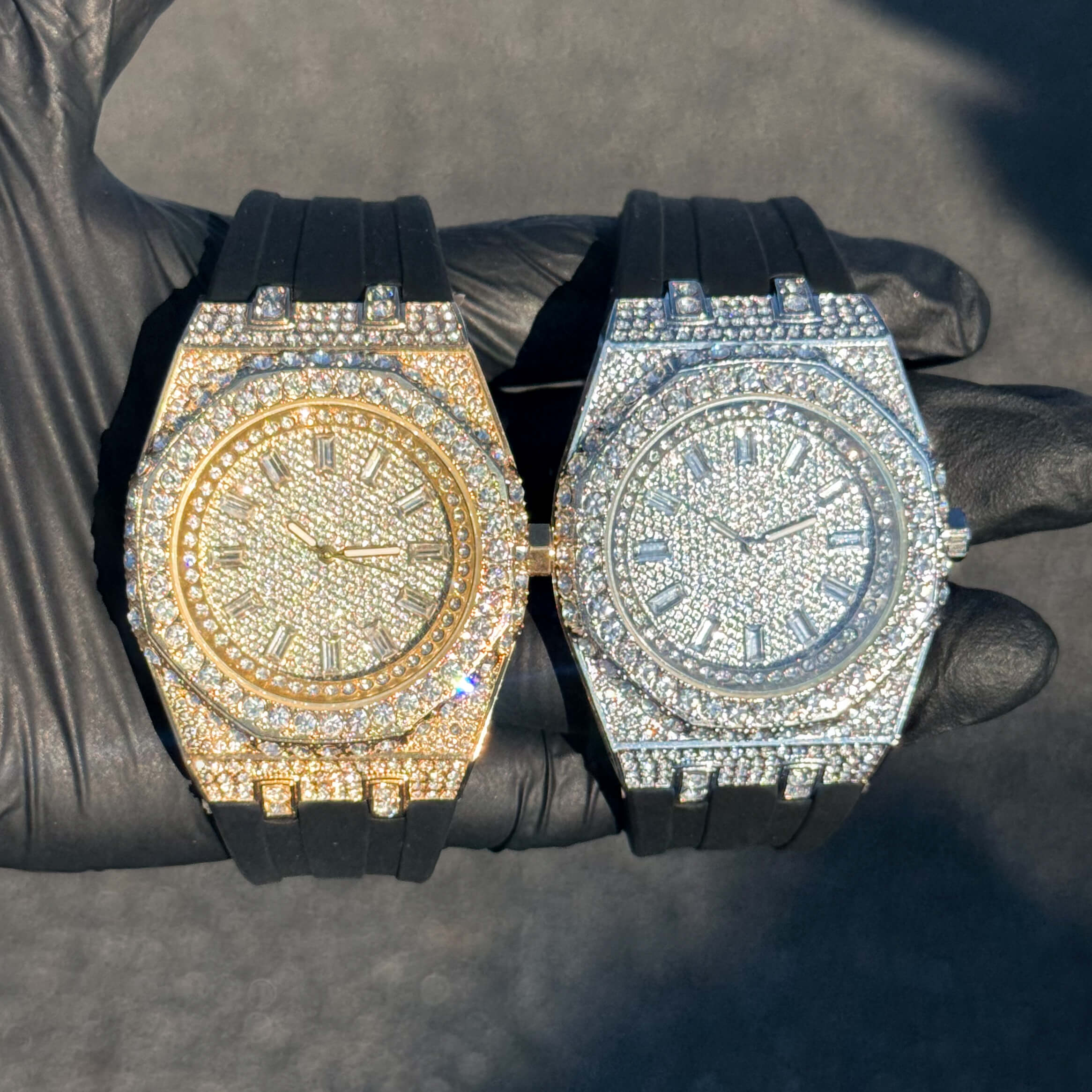 Men's 43mm iced out octagonal dial watches in gold and silver with silicone bands displayed together.