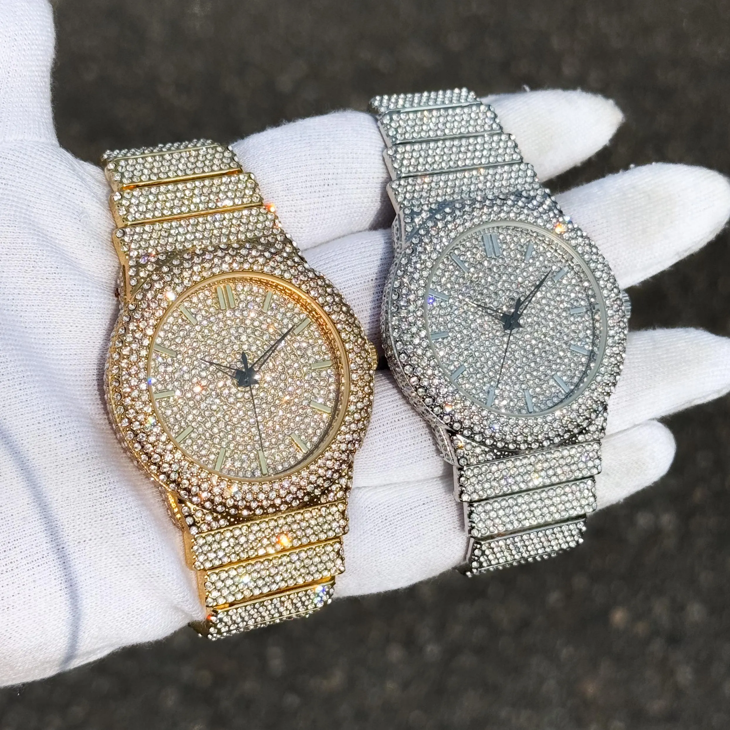 Gold and silver men’s 46mm luxury diamond watches with fully iced-out round dials and crystal bezels.