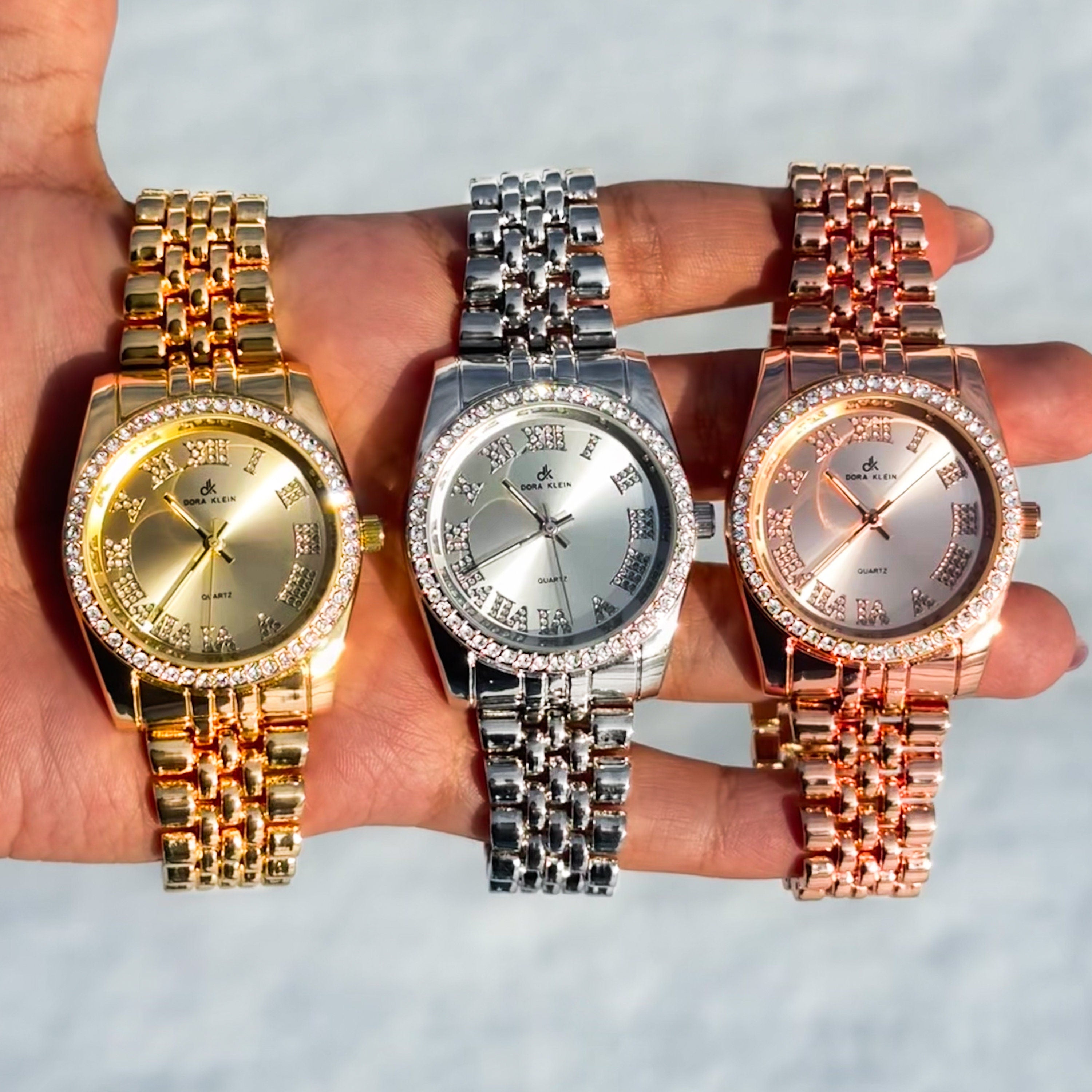 Women's 35mm metal band watches in gold, silver and rose gold with Roman dial and crystal bezel.